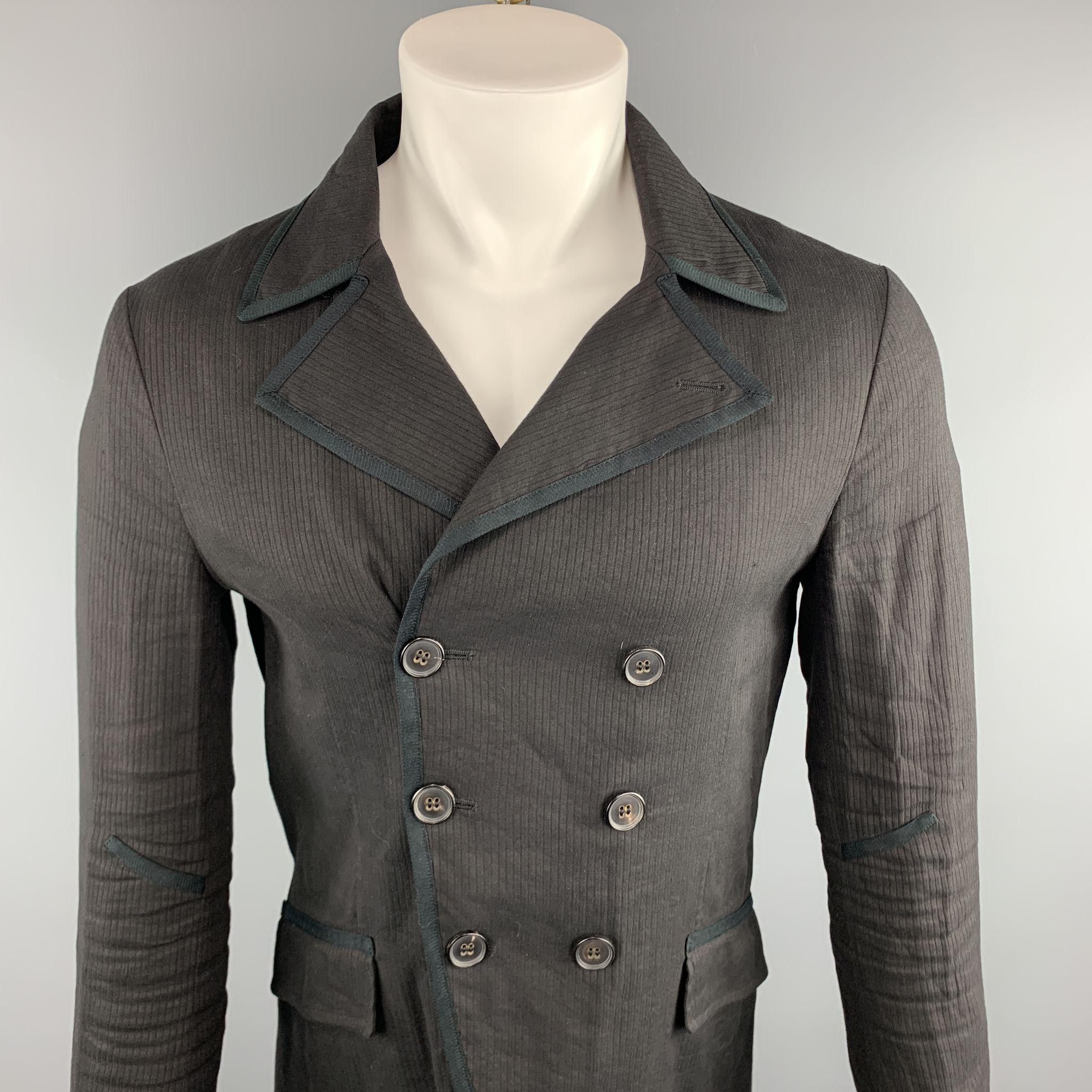 JOHN VARVATOS Jacket comes in a black viscose blend featuring a double breasted style and flap pockets. Made in Italy. 

Excellent Pre-Owned Condition.
Marked: 44

Measurements:

Shoulder: 17 in. 
Chest: 38 in. 
Sleeve: 24 in. 
Length: 28 in. 

SKU: