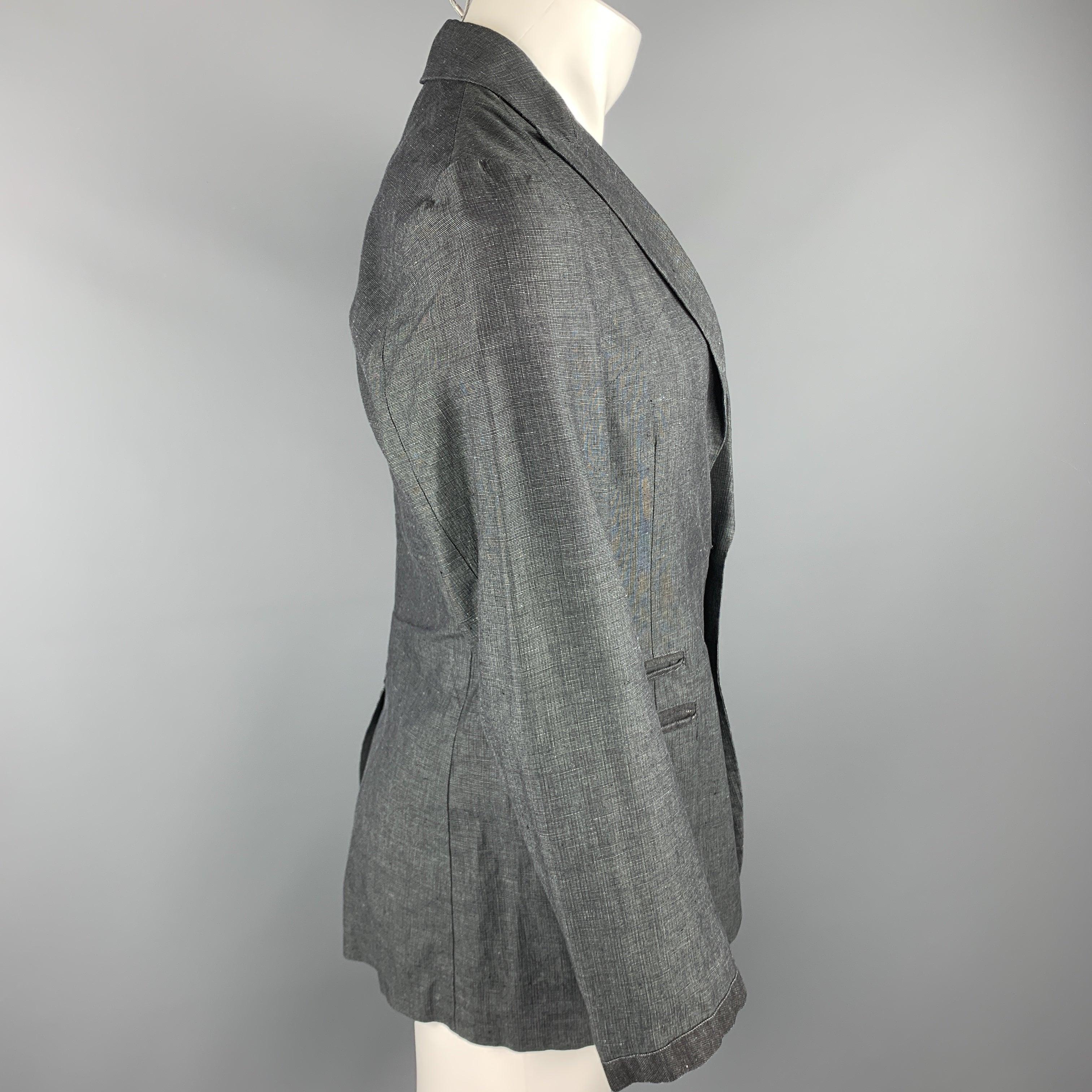 JOHN VARVATOS sport coat comes in a dark gray heather linen / cotton featuring a peak lapel style, stitching details, slit pockets, and and a two button closure. Made in Italy.Excellent
Pre-Owned Condition. 

Marked:   IT 46 

Measurements: 
