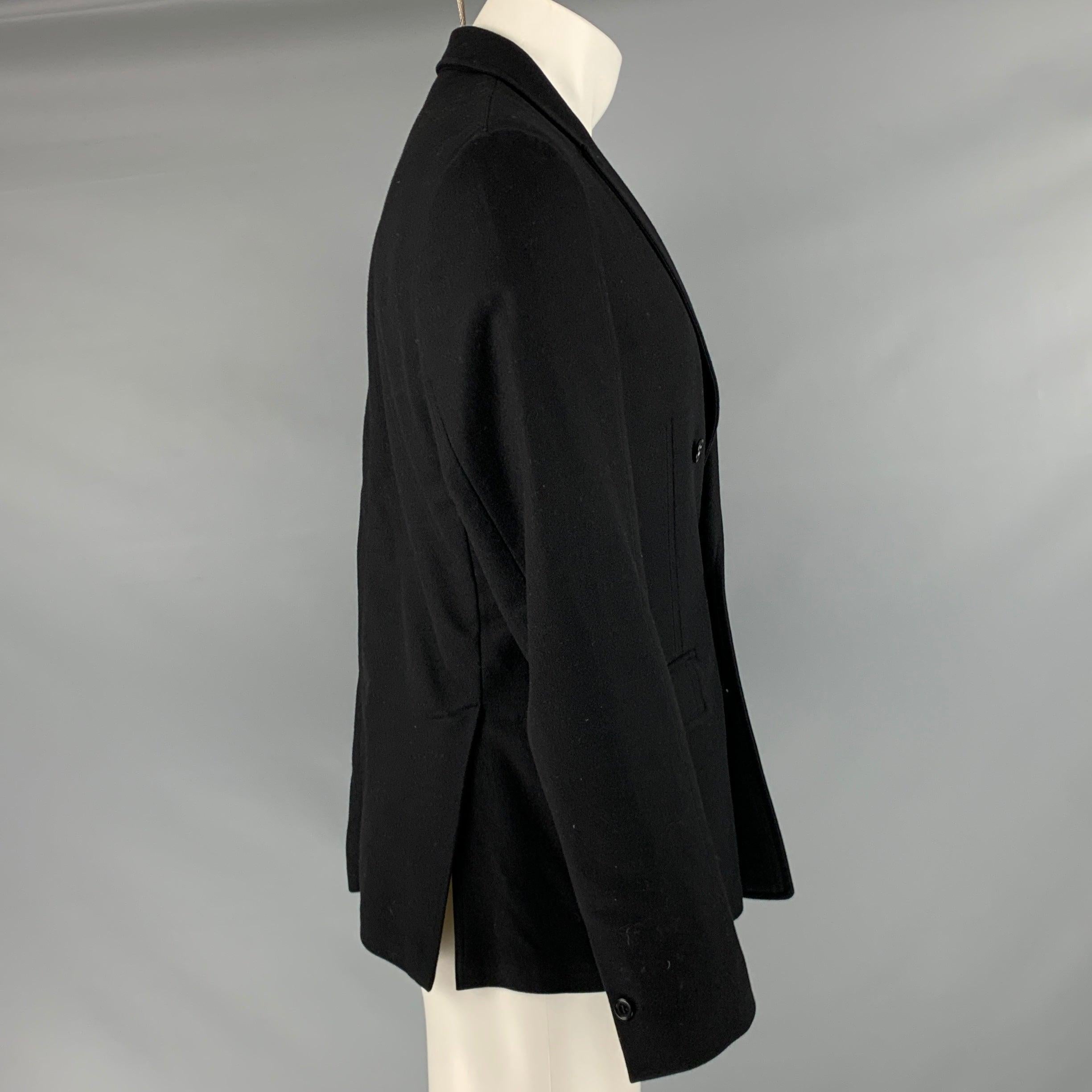 JOHN VARVATOS jacket
in a black virgin wool blend fabric featuring a double-breasted style, peak lapel, and double button closure. Made in Italy.Good Pre-Owned Condition.
Moderate signs of wear and marks under arms. 

Marked:   48 

Measurements: 
