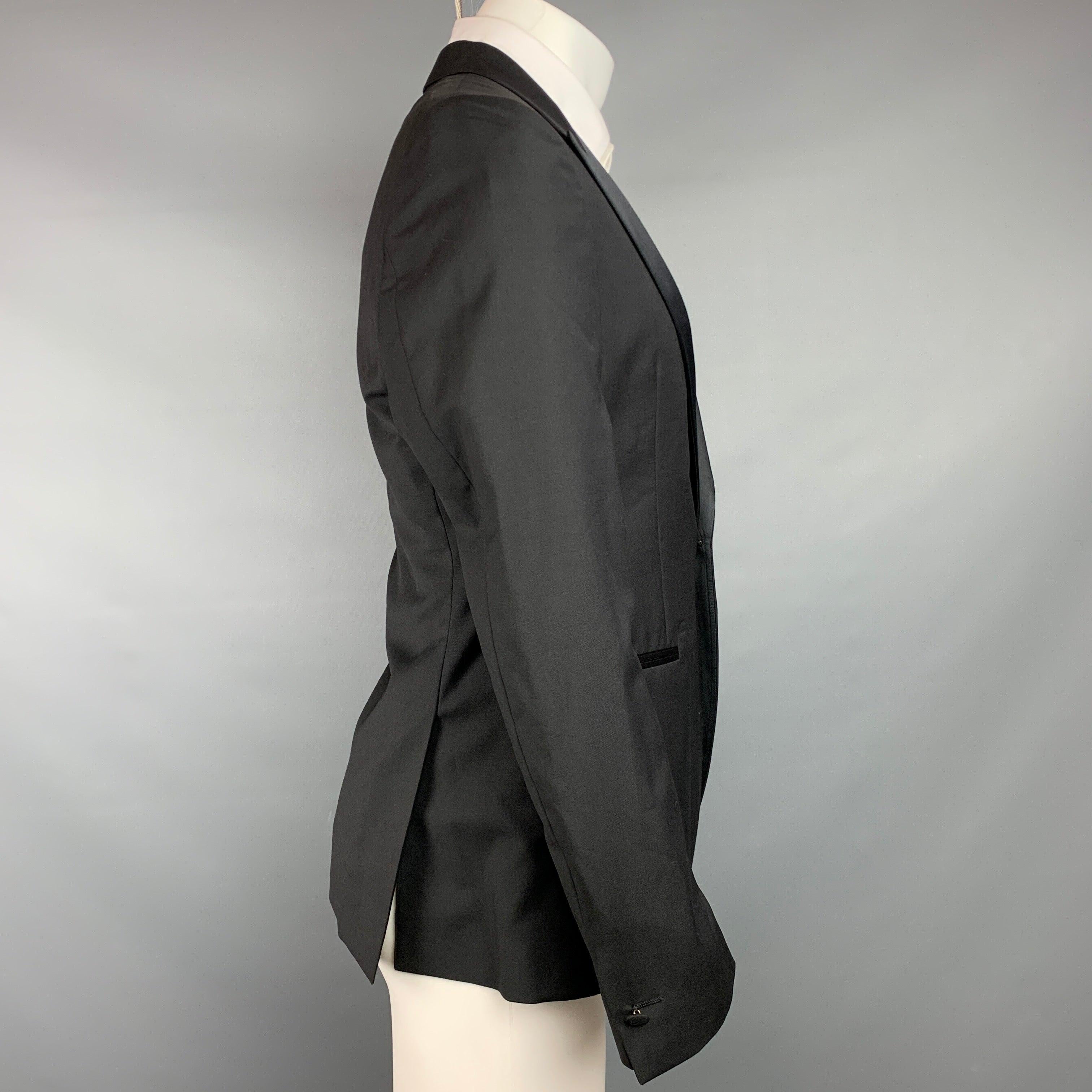 JOHN VARVATOS sport coat in a black wool / mohair with a full liner featuring a peak lapel, slit pockets, and a single button closure. Made in Italy.Very Good
Pre-Owned Condition. 

Marked:   48 

Measurements: 
 
Shoulder: 17.5 inches  Chest: 38