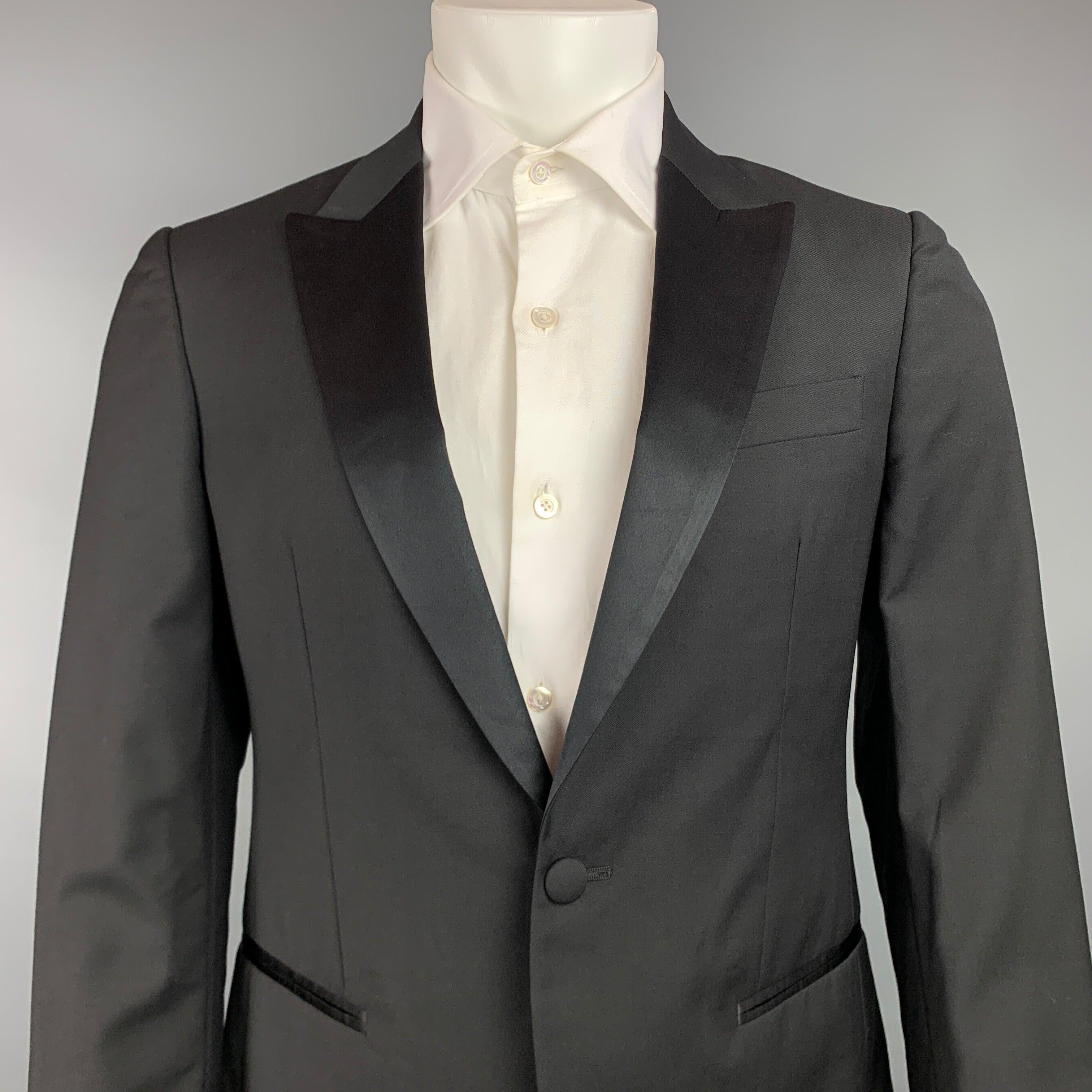 JOHN VARVATOS sport coat comes in a black wool / mohair with a full liner featuring a peak lapel, slit pockets, and a single button closure. Made in Italy.Very Good
Pre-Owned Condition. 

Marked:   48 

Measurements: 
 
Shoulder: 17.5 inches  Chest: