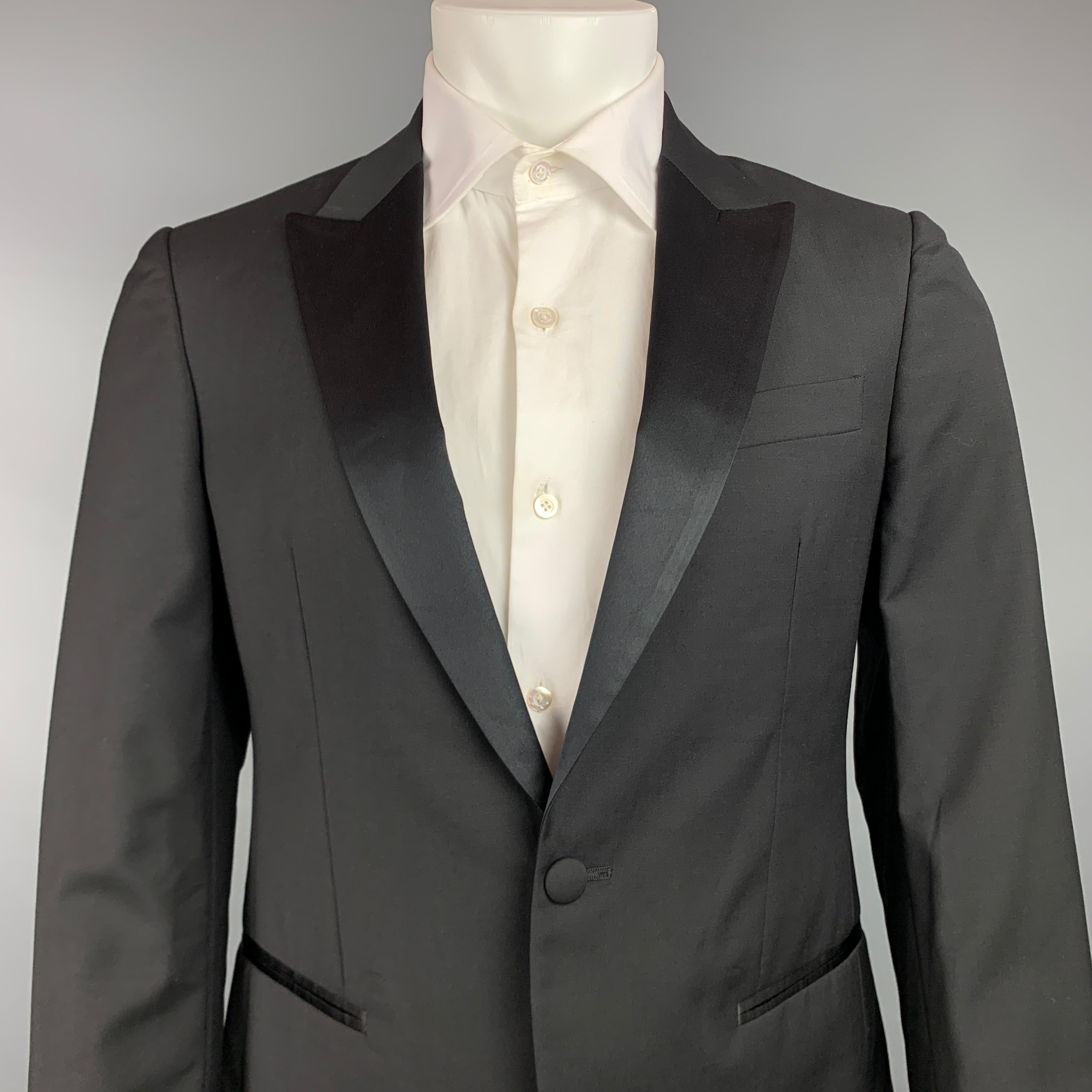 JOHN VARVATOS sport coat comes in a black wool / mohair with a full liner featuring a peak lapel, slit pockets, and a single button closure. Made in Italy.

Very Good Pre-Owned Condition.
Marked: 48

Measurements:

Shoulder: 17.5 in.
Chest: 38