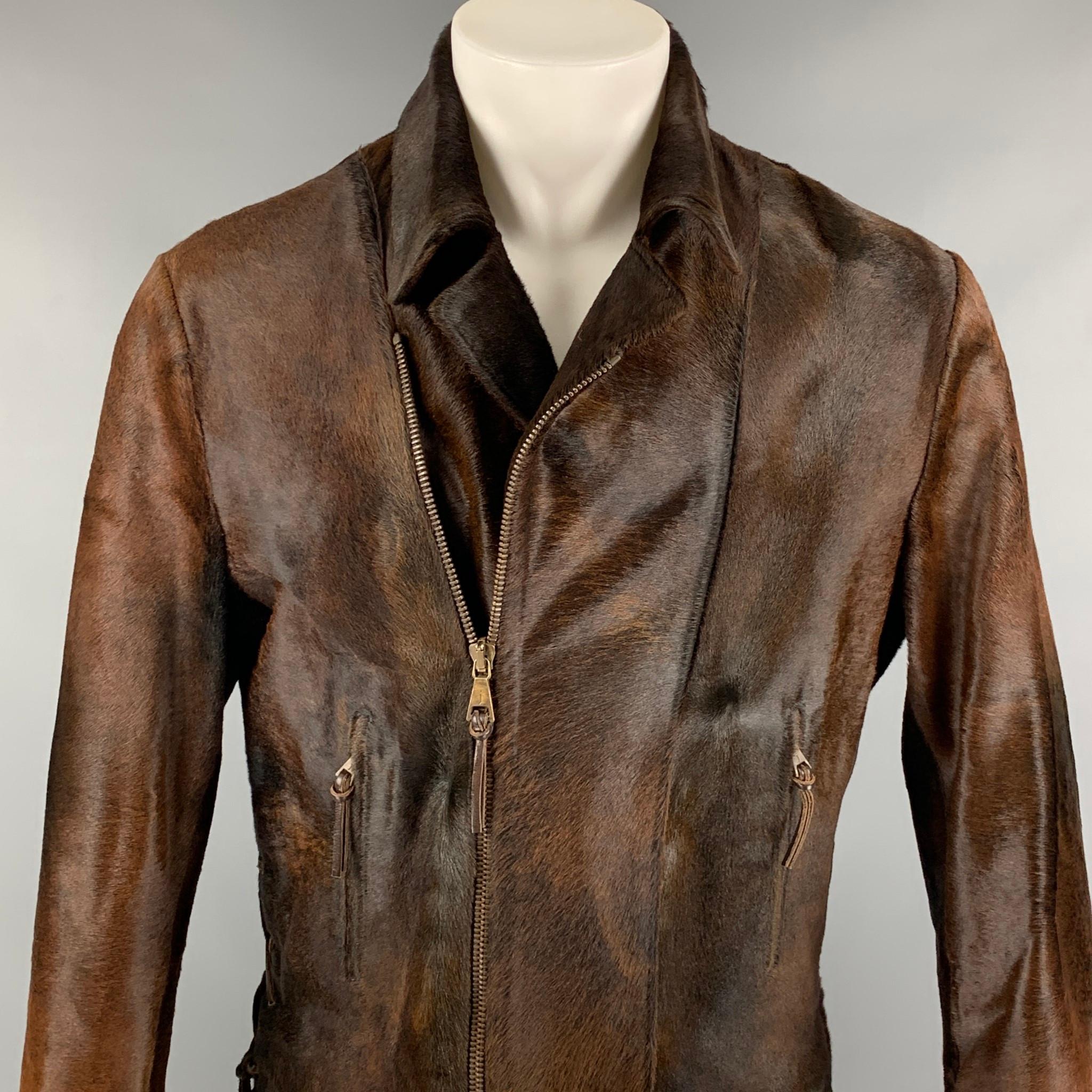 JOHN VARVATOS jacket comes in a brown calf hair with a full liner featuring side leather strap tie details, front pockets, zipper sleeves, and a full zip up closure. 

Very Good Pre-Owned Condition.
Marked: 50
Original Retail Price: