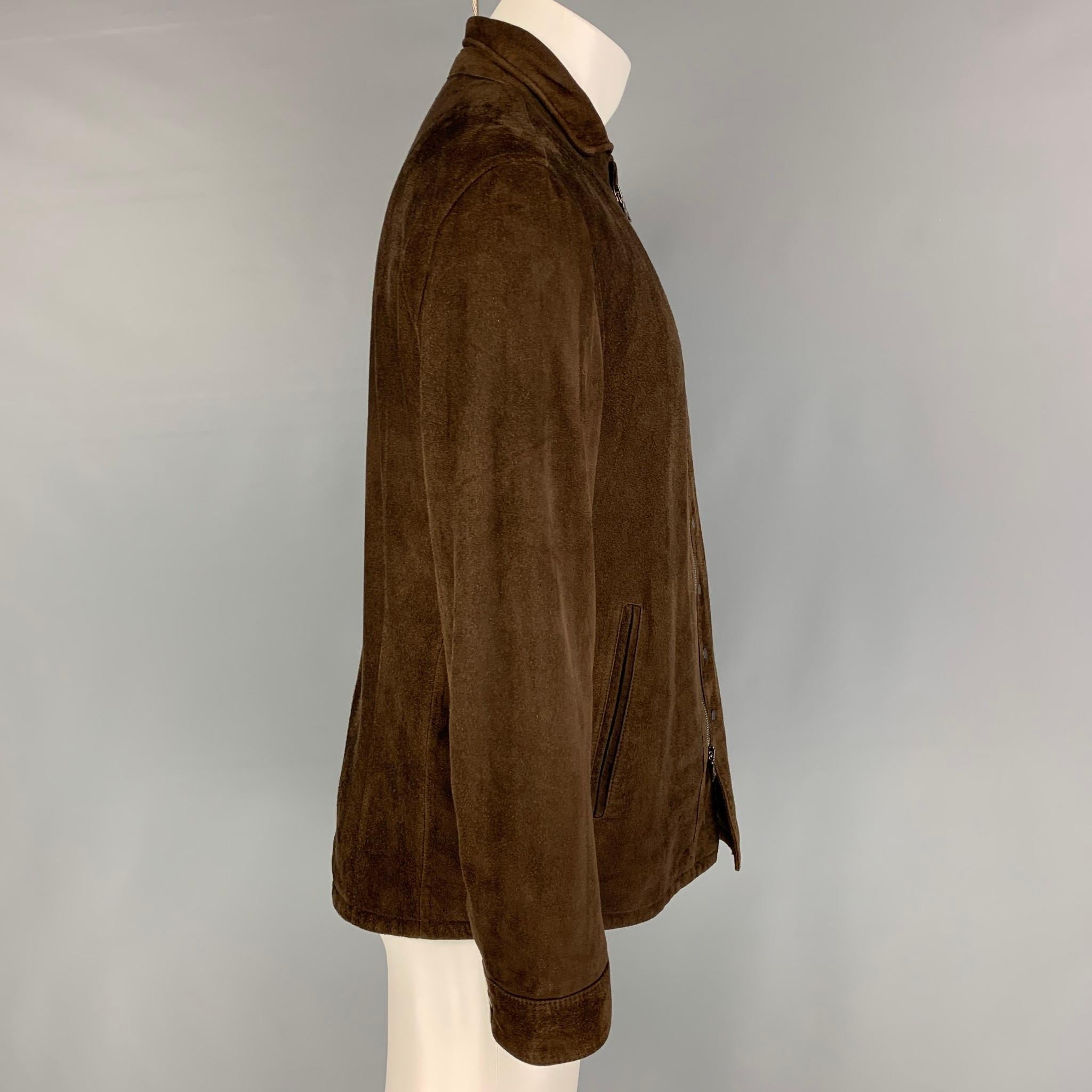 JOHN VARVATOS jacket comes in a brown suede featuring a small spread collar, front pockets, and a zip & snap button closure. 

Very Good Pre-Owned Condition.
Marked: 50
Original Retail Price: $1,998.00

Measurements:

Shoulder: 18 in.
Chest: 40