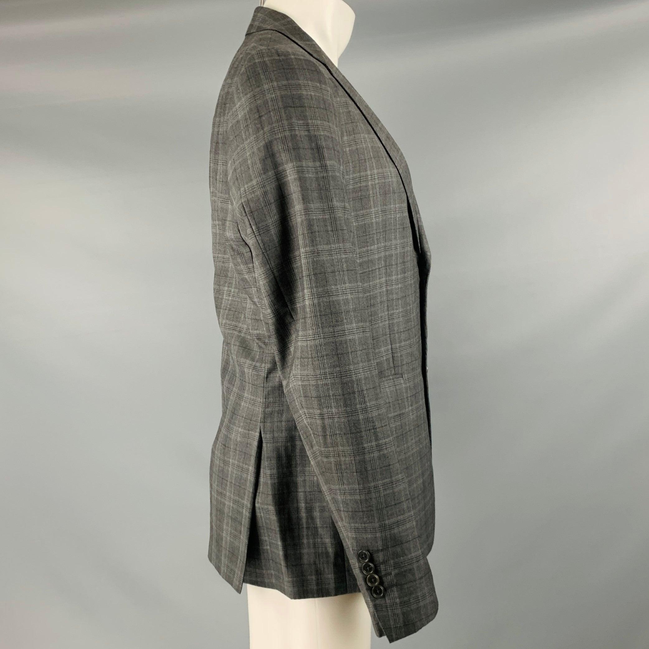 JOHN VARVATOS sport coat
in a grey & charcoal grey wool silk blend fabric featuring a plaid pattern, notch lapel, double vented back, ad double button closure. Made in Italy.Excellent Pre-Owned Condition. 

Marked:   50L 

Measurements: 
 
Shoulder: