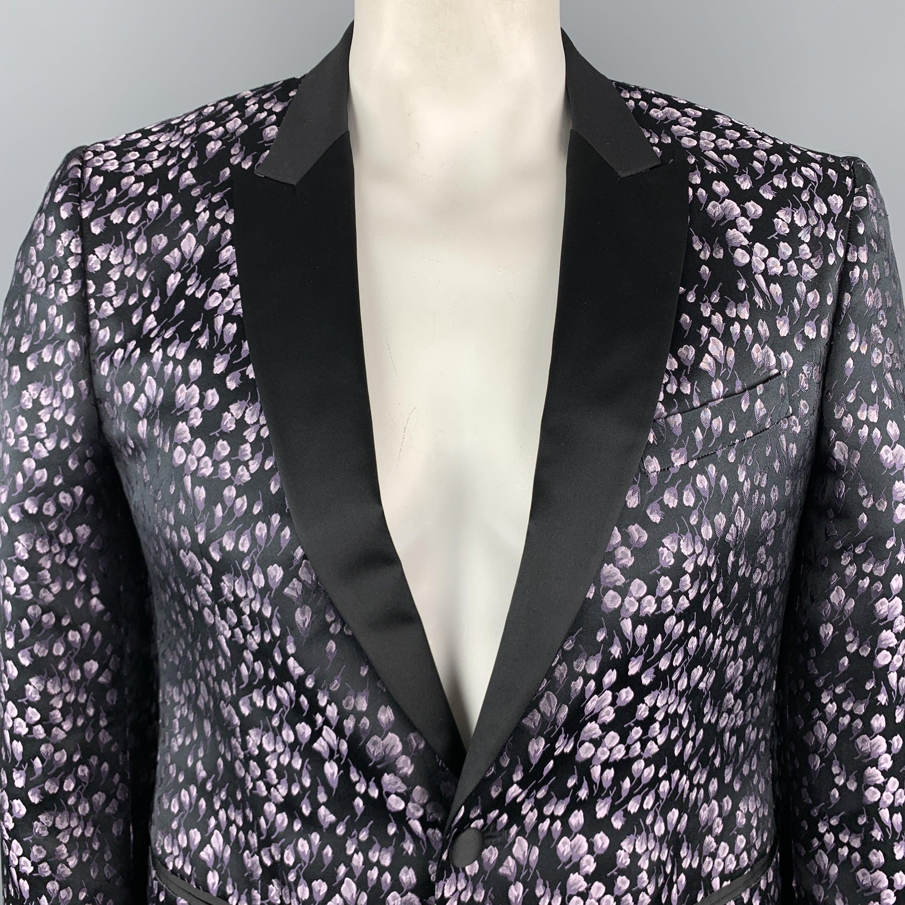 JOHN VARVATOS dinner jacket comes in black and lavender floral print silk satin jacquard with a black satin peak lapel, single breasted, one
 button front, and double vented back. Wear at back. Made in Italy.
Very Good Pre-Owned Condition.
