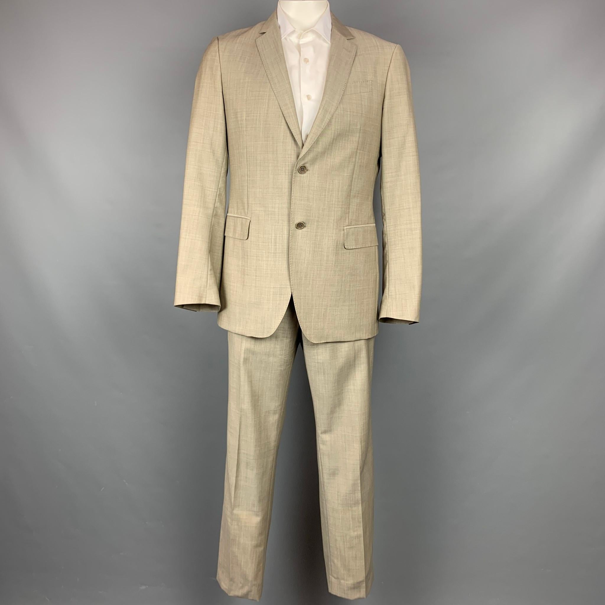 JOHN VARVATOS suit comes in a oatmeal heather wool / mohair with a full liner and includes a single breasted, two button sport coat with a notch lapel and matching flat front trousers. Made in Italy.

Very Good Pre-Owned Condition.
Marked: Jacket:
