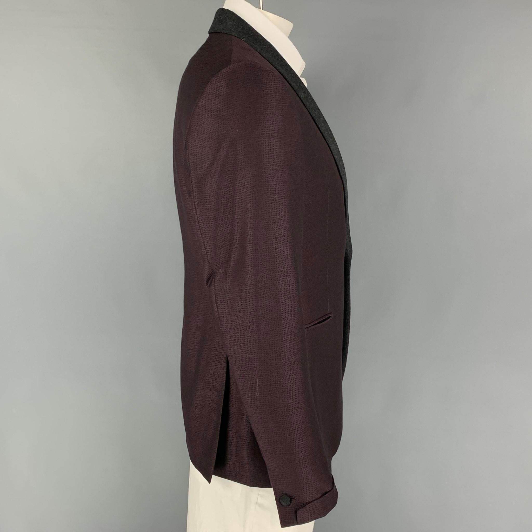 JOHN VARVATOS sport coat comes in a purple & charcoal jacquard wool with a full liner featuring a shawl collar, slit pockets, double back vent, and a single button closure. Made in Italy. 

Very Good Pre-Owned Condition.
Marked: