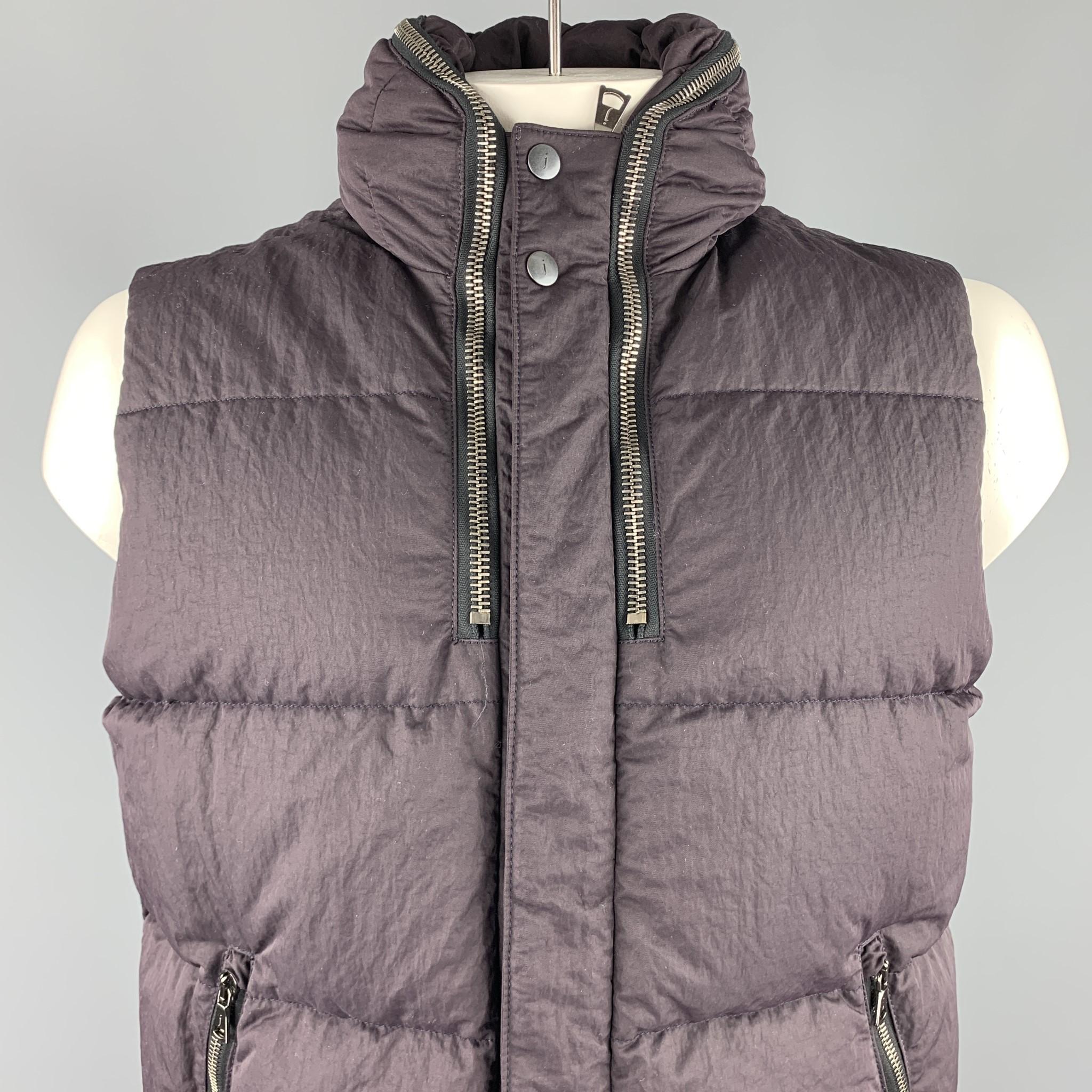 JOHN VARVATOS vest comes in a eggplant quilted polyamide featuring a zipper hooded design, zipper pockets, and a zip & snap button closure.

New With Tags.
Marked: 54

Measurements:

Shoulder: 17 in. 
Chest: 46 in. 
Length: 26.5 in. 