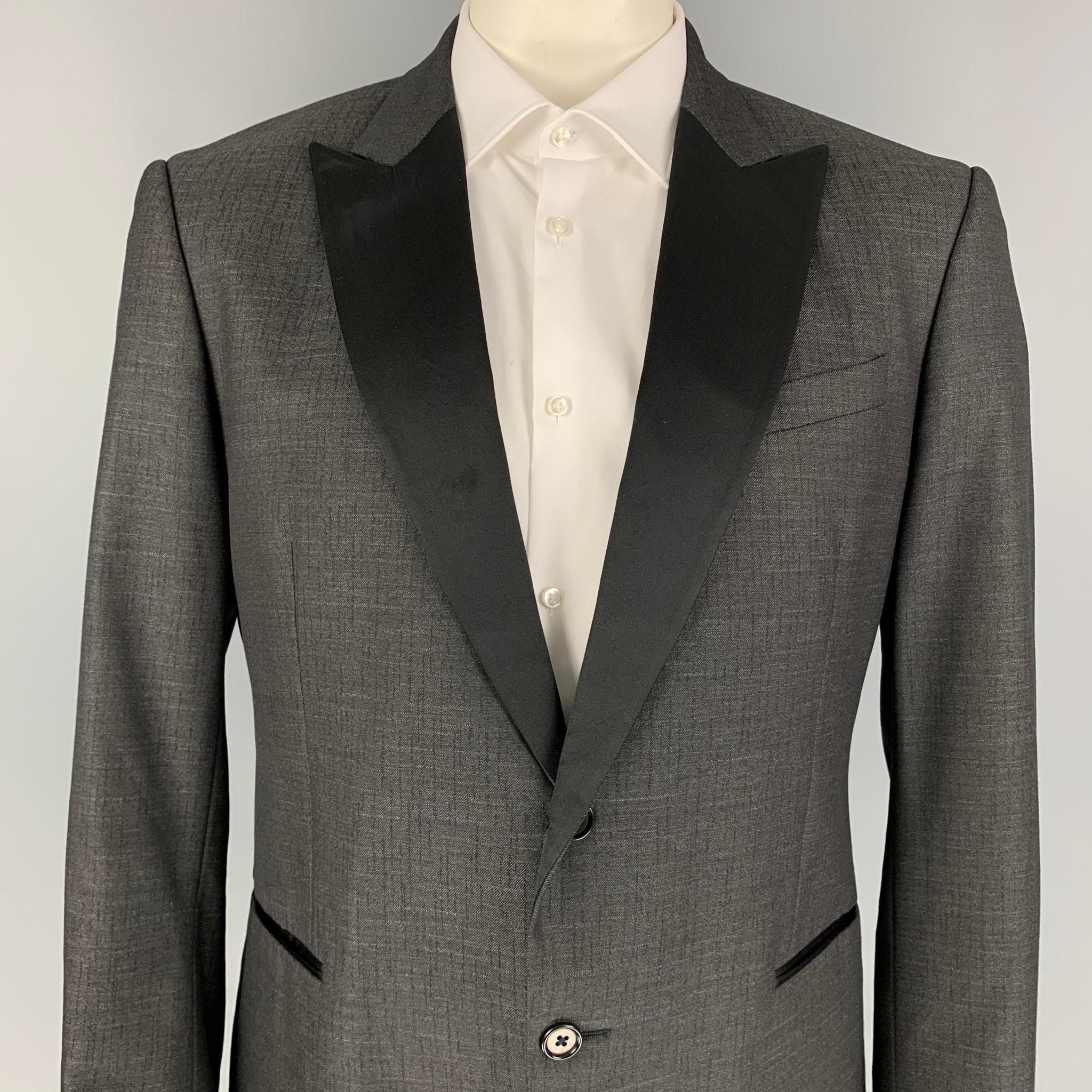 JOHN VARVATOS sport coat comes in a dark gray wool / silk with a full liner featuring a peak lapel, slit pockets, double back vent, and a two button closure. Made in Italy. 

Very Good Pre-Owned Condition.
Marked: 56

Measurements:

Shoulder: 19