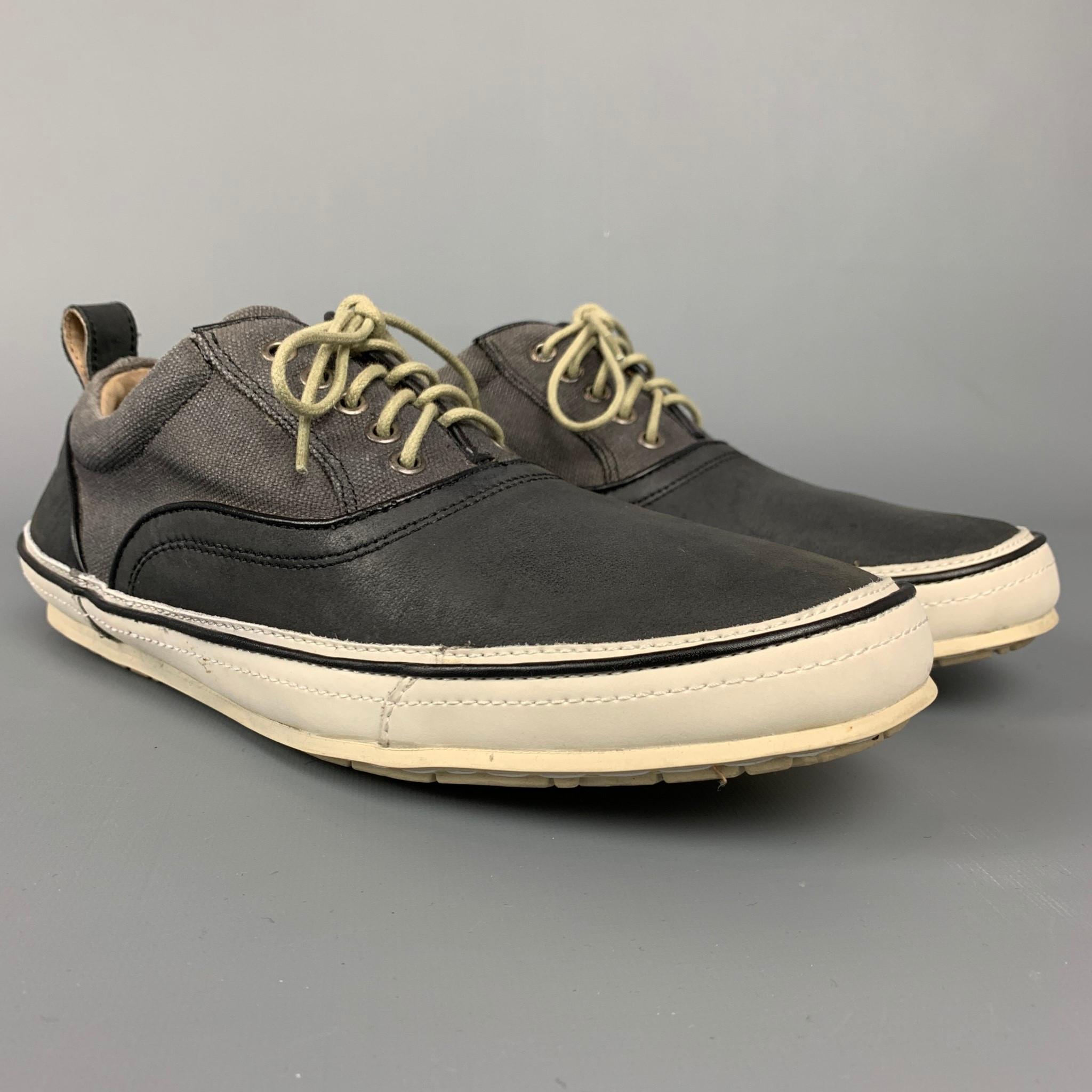 JOHN VARVATOS sneakers comes in a grey two toned canvas featuring a rubber sole and a lace up closure. Comes with green laces. 

Good Pre-Owned Condition.
Marked: 8 M

Outsole: 3.5 in. x 10.5 in. 