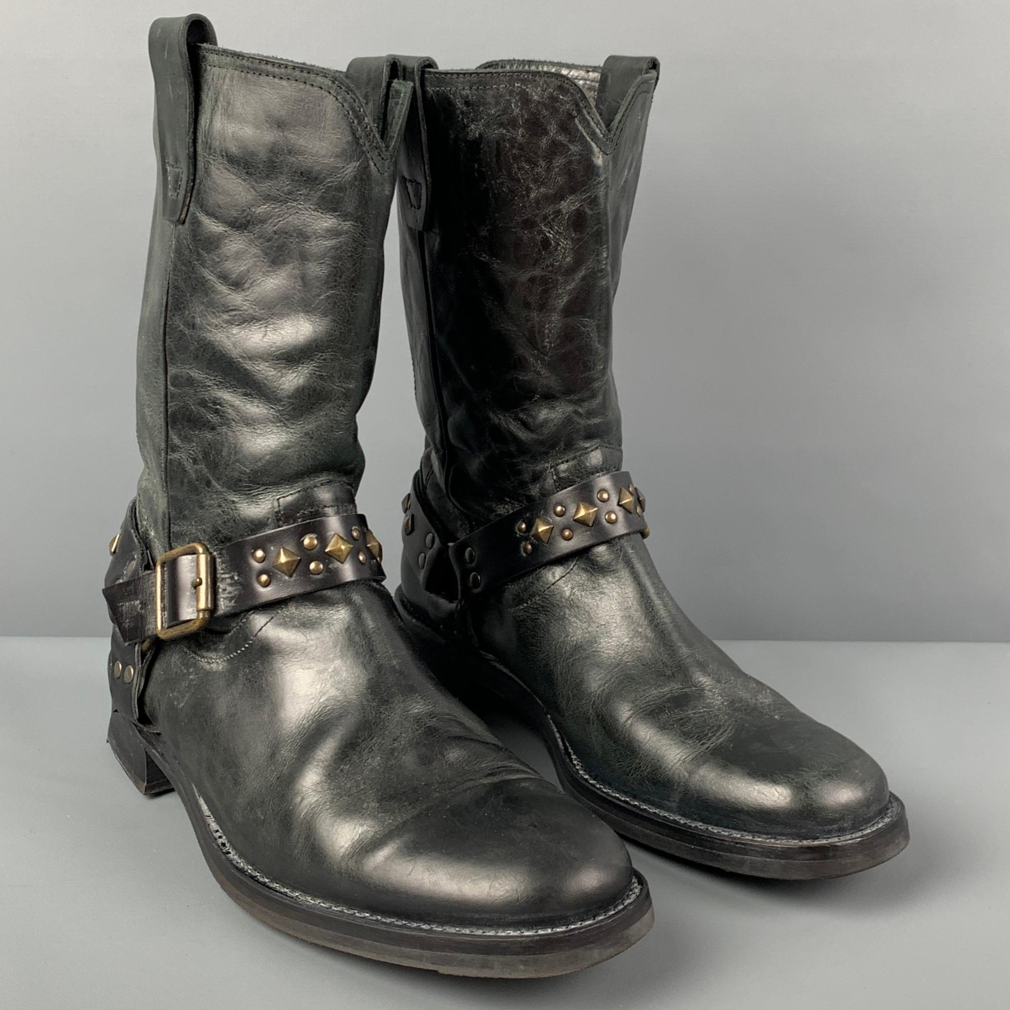 JOHN VARVATOS boots comes in a black leather featuring a buckle strap detail, studded embellishment, oil resistant, and a round toe. Made in Italy. 

Very Good Pre-Owned Condition.
Marked: 9.5

Measurements:

Length: 12.5 in.
Width: 4 in.
Height: