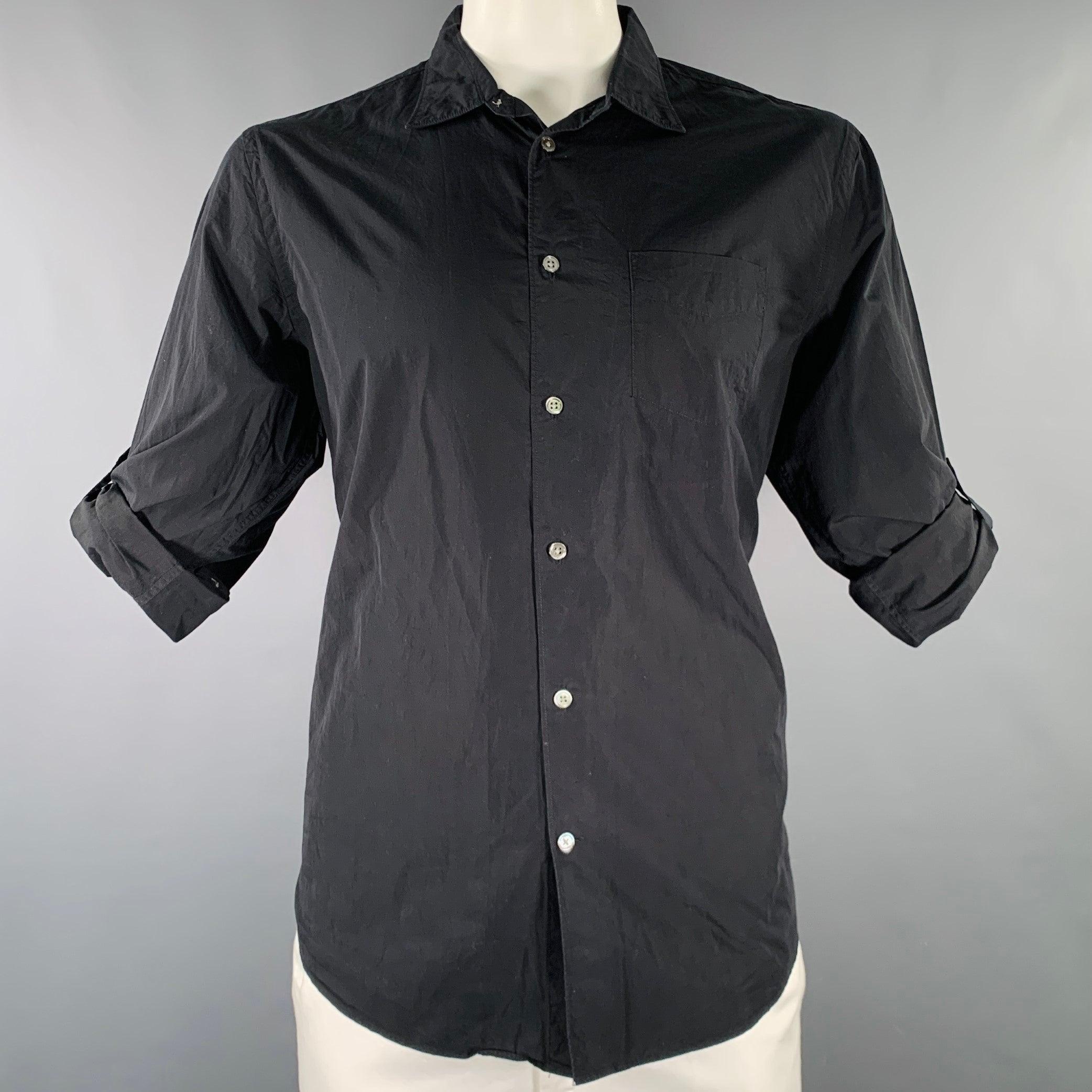 JOHN VARVATOS long sleeve shirt in a black cotton woven fabric featuring roll-tab sleeves for the option of a casual look, one pocket, and button closure.Excellent Pre-Owned Condition. 

Marked:   L 

Measurements: 
 
Shoulder: 18 inches Chest: 43