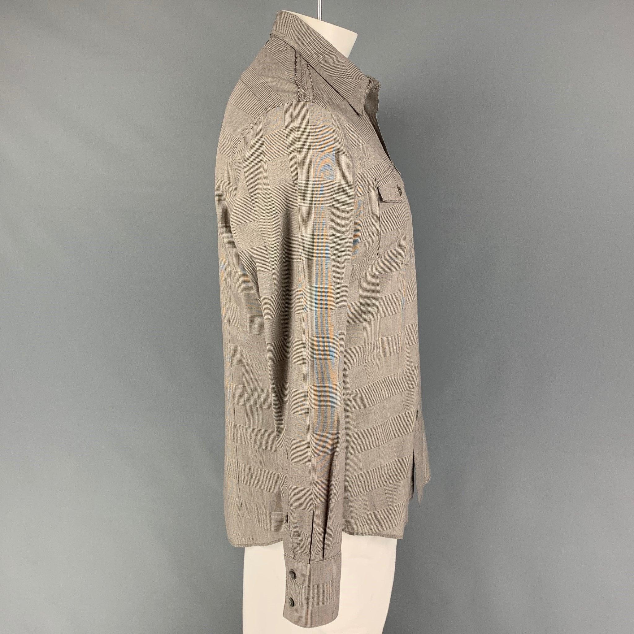JOHN VARVATOS long sleeve shirt comes in a grey glenplaid cotton featuring a pointed collar, patch pockets, and a button up closure.
Very Good
Pre-Owned Condition. 

Marked:   L  

Measurements: 
 
Shoulder: 19 inches  Chest: 42 inches  Sleeve: 26.5