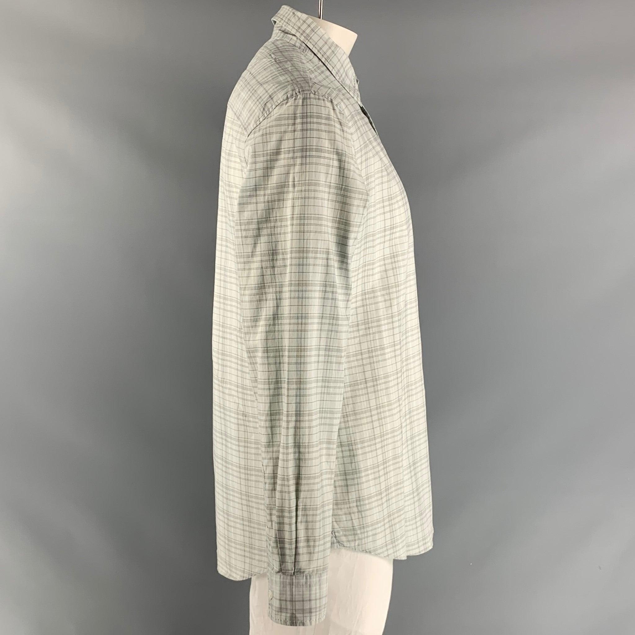 JOHN VARVATOS long sleeve shirt comes in grey plaid cotton featuring top stitch detail, straight collar, one button square cuff, and button up closure. Excellent Pre-Owned Condition.  

Marked:   L 

Measurements: 
 
Shoulder: 20 inches Chest: 46