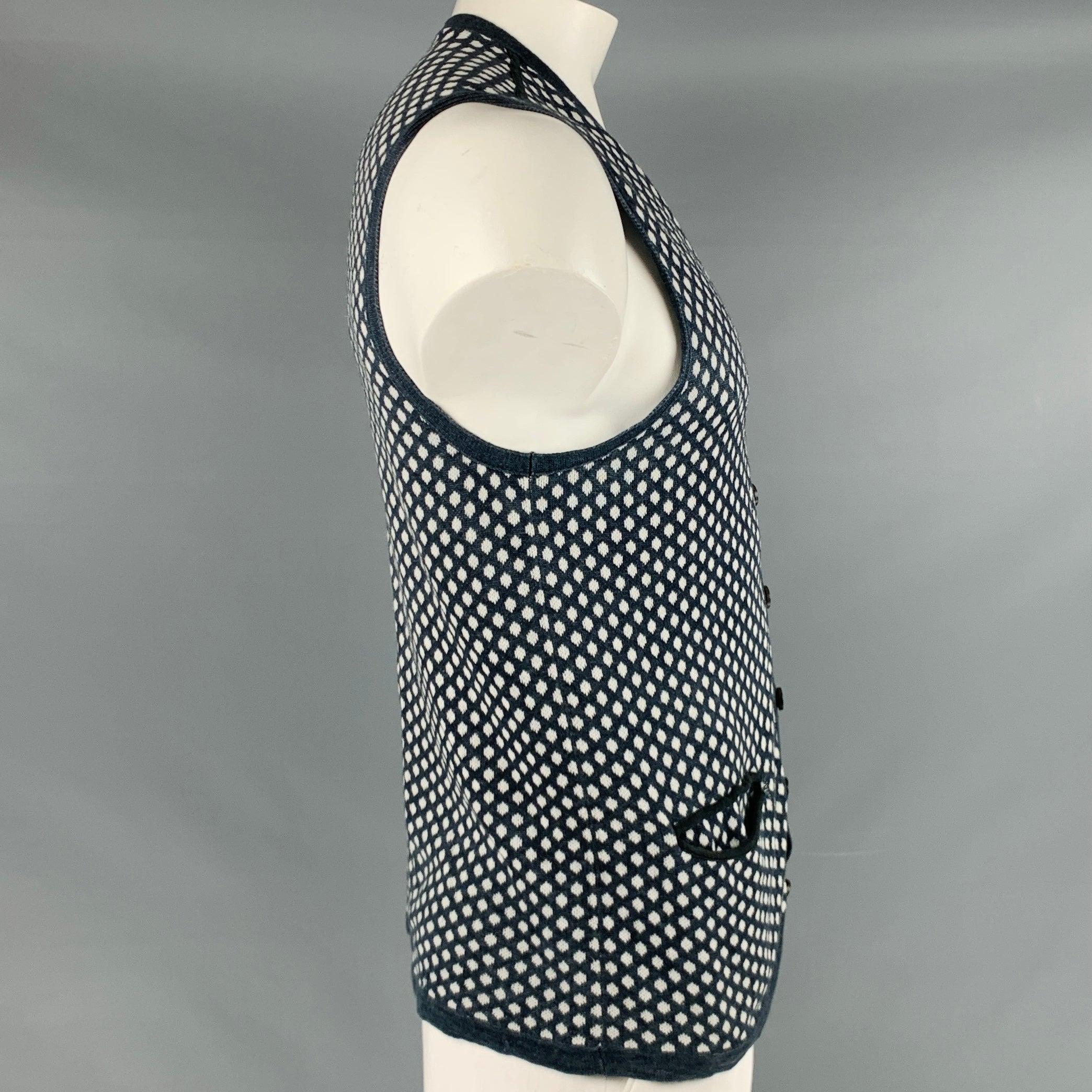 JOHN VARVATOS vest in a navy linen cotton blend knit featuring white dots pattern, two small pockets, V-neck, and button closure.Excellent Pre-Owned Condition. 

Marked:   L 

Measurements: 
 
Shoulder: 13.5 inches Chest: 41 inches Length: 27.5