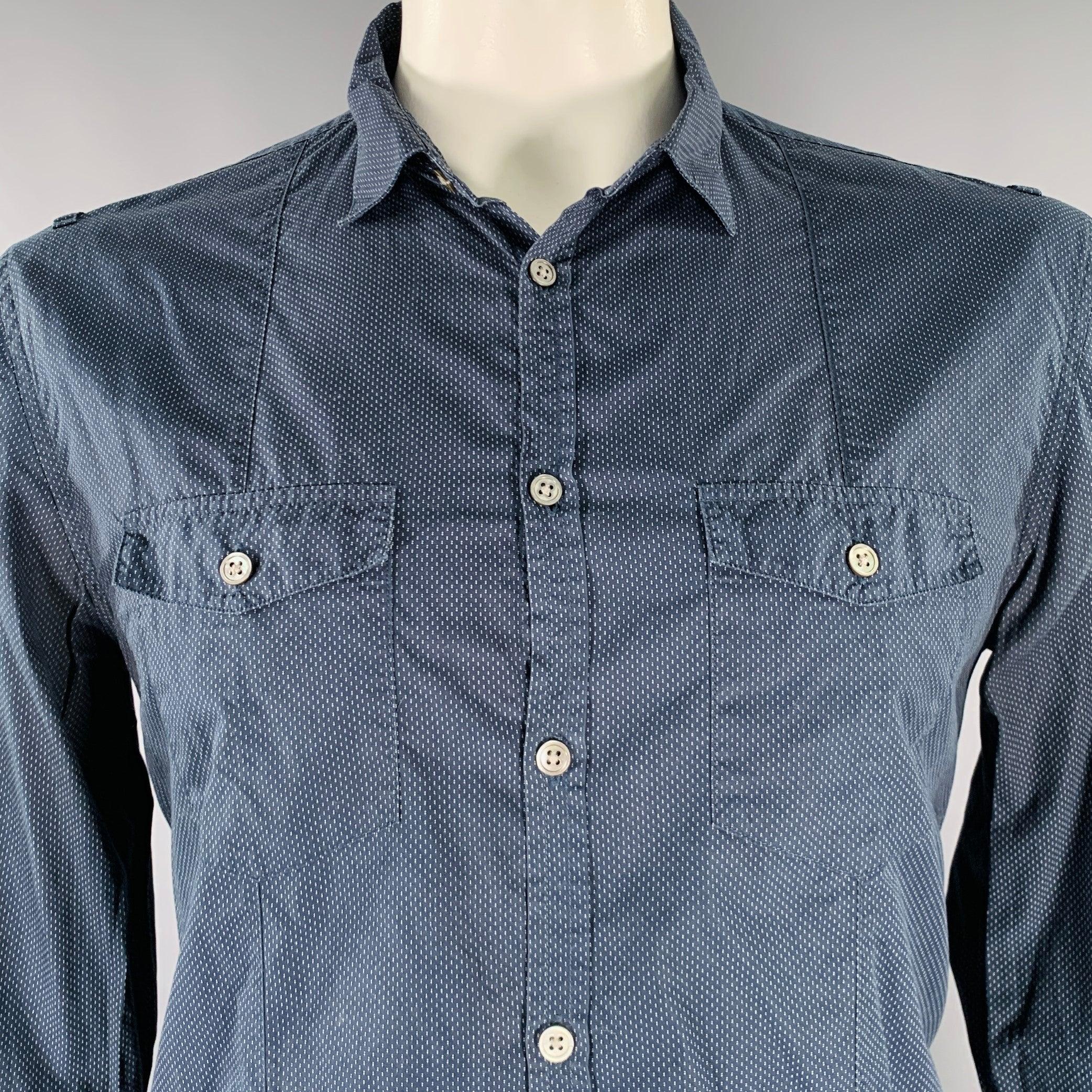 JOHN VARVATOS long sleeve shirt in a navy cotton woven fabric featuring a white nailhead pattern, buttoned pockets, and button closure.Excellent Pre-Owned Condition. 

Marked:   L 

Measurements: 
 
Shoulder: 17.5 inches Chest: 41 inches Sleeve: 26