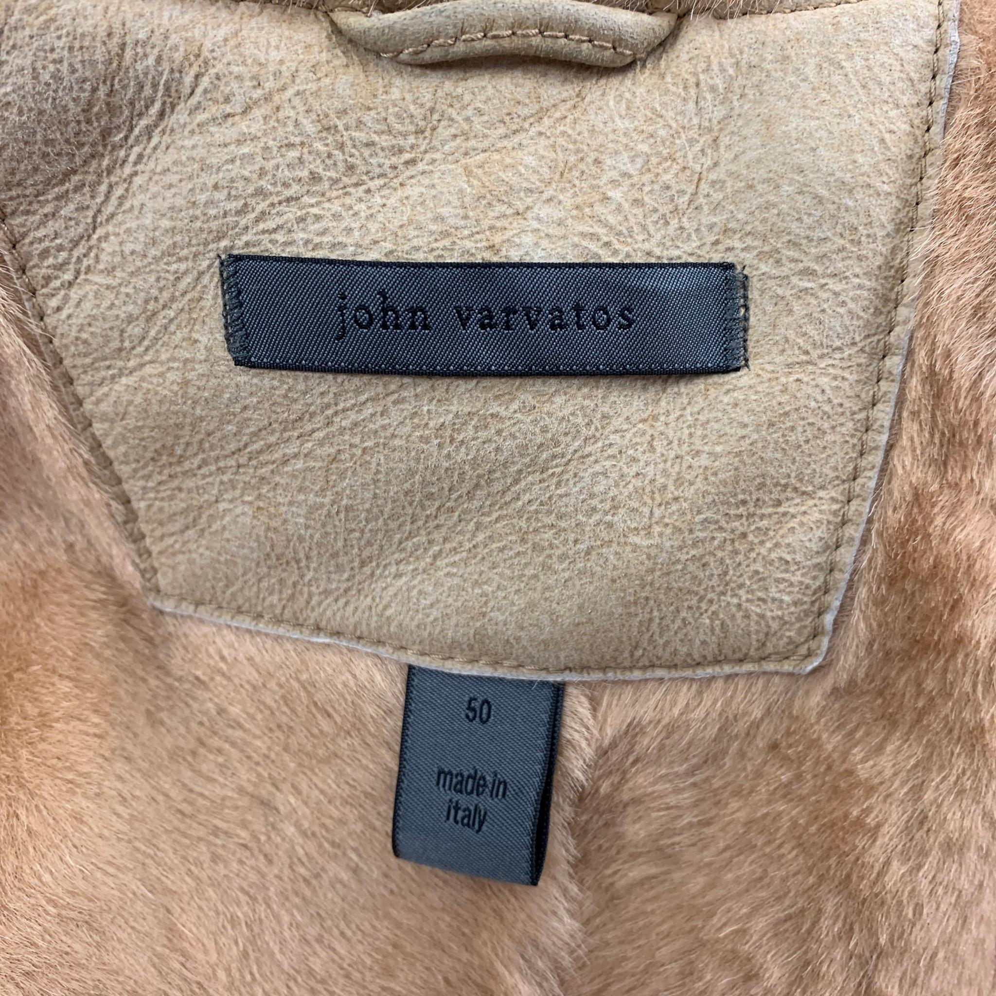 JOHN VARVATOS coat comes in a beige shearling with a fur liner featuring a spread collar, flap pockets, and a buttoned closure. Made in Italy.

Very Good Pre-Owned Condition.
Marked: 50

Measurements:

Shoulder: 20 in.
Chest: 46 in.
Sleeve: 26