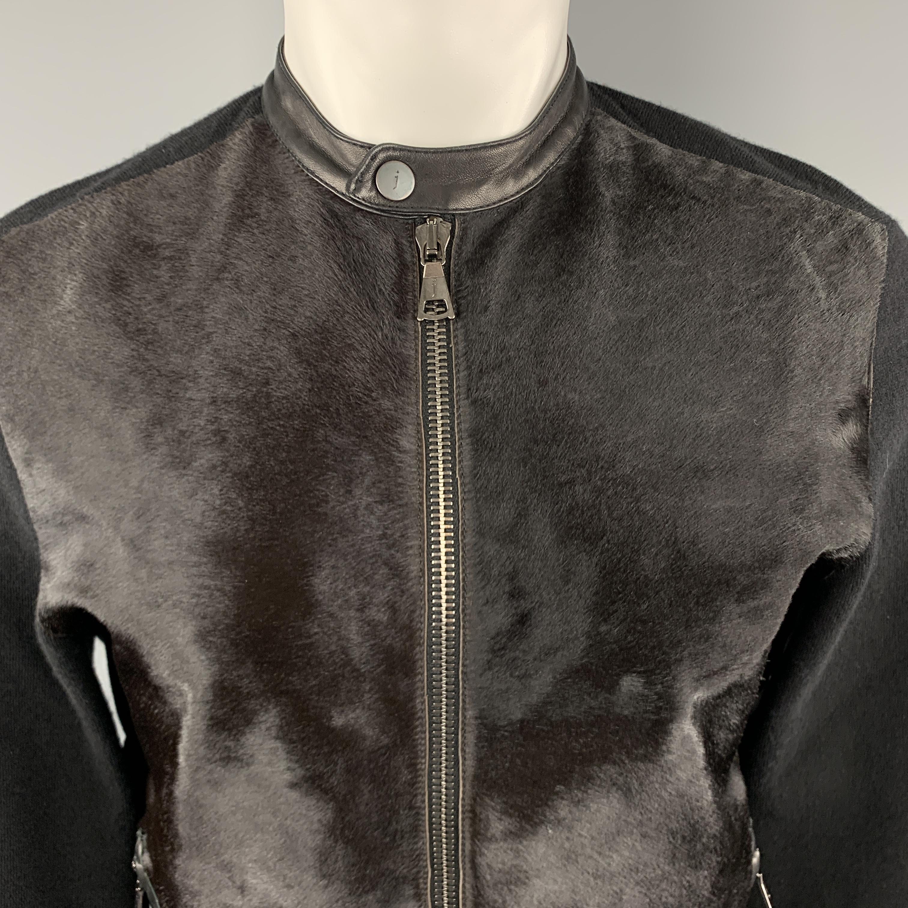 JOHN VARVATOS jacket comes in a stretch cashmere blend knit with a ponyhair leather frontal panel, zip pockets, and leather snap biker jacket collar. 

Excellent Pre-Owned Condition.
Marked: M

Measurements:

Shoulder: 16.5 in.
Chest: 42 in.
Sleeve: