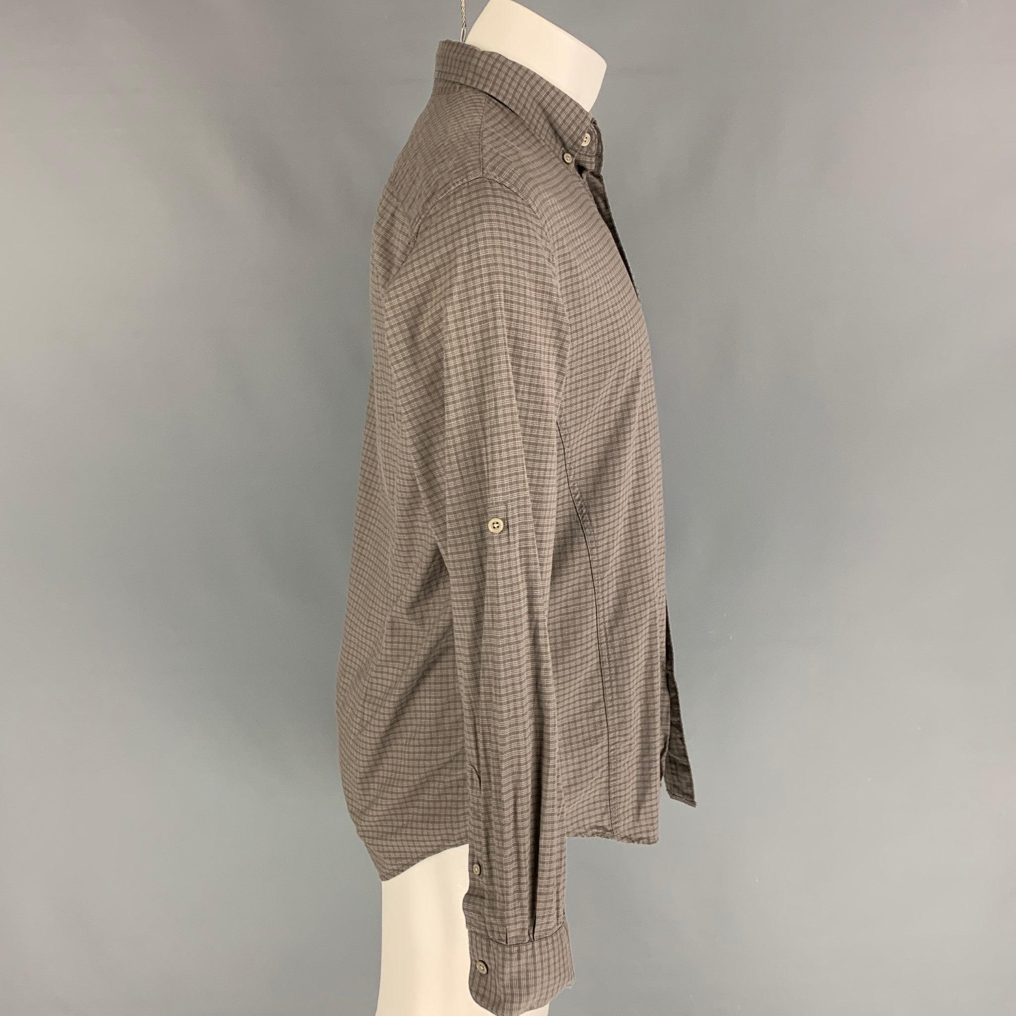 JOHN VARVATOS long sleeve shirt comes in a brown checkered cotton featuring a button down closure, patch pocket, and a button up closure.
Very Good
Pre-Owned Condition. 

Marked:   M  

Measurements: 
 
Shoulder: 18 inches  Chest: 40 inches  Sleeve: