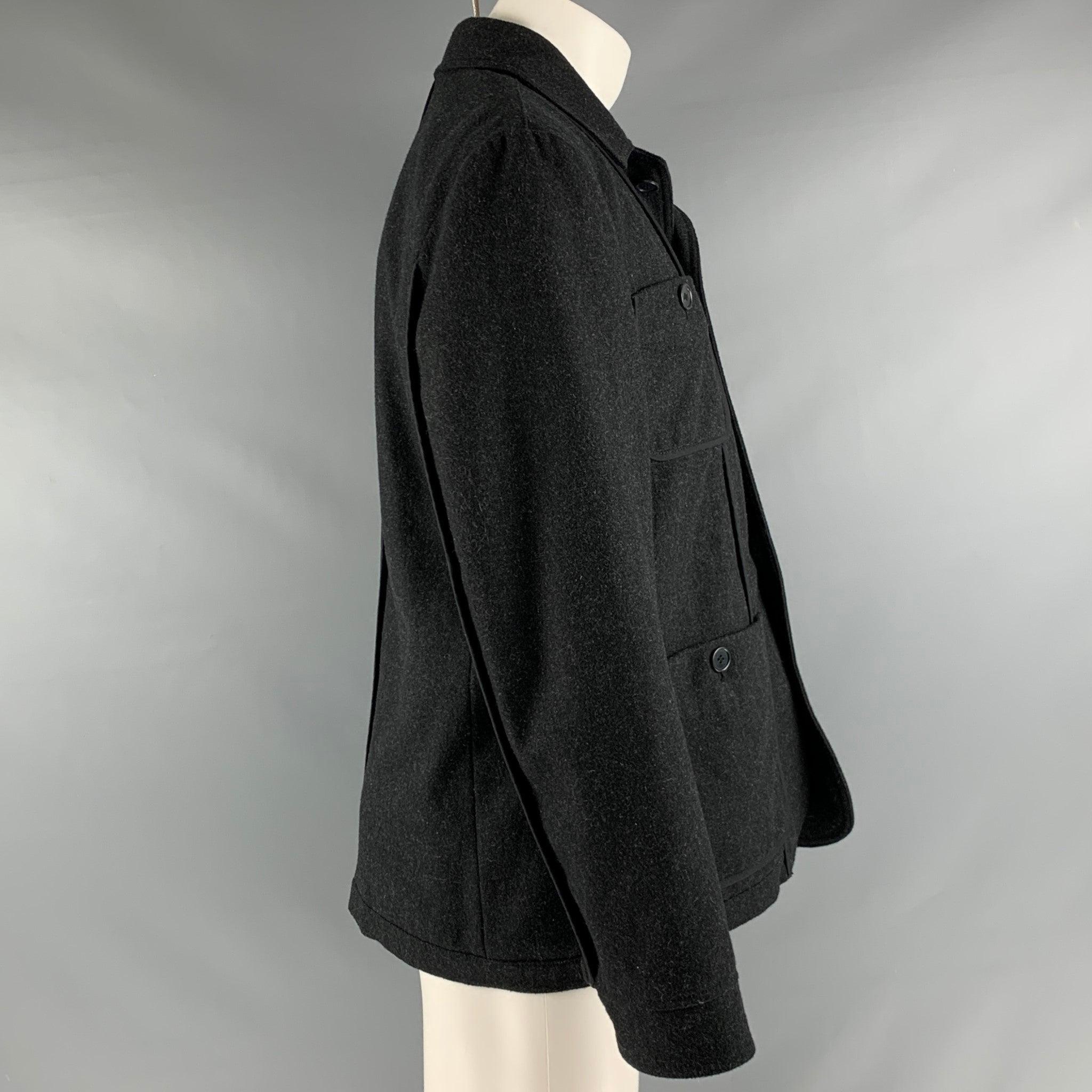 JOHN VARVATOS jacket in a black polyester blend featuring a single breasted style and four buttoned pockets.Very Good Pre-Owned Condition. Minor signs of wear. 

Marked:   M 

Measurements: 
 
Shoulder: 17 inches  Chest: 40 inches  Sleeve: 25.5