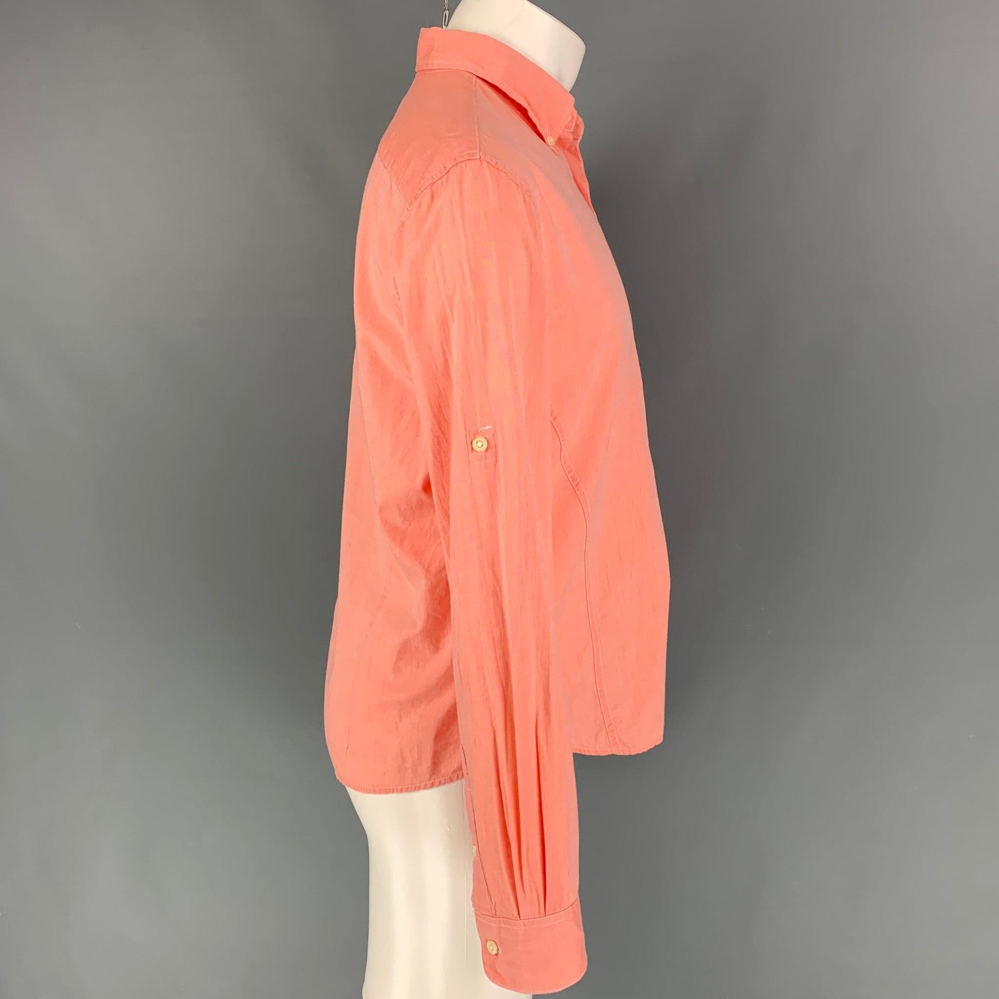 JOHN VARVATOS long sleeve shirt comes in a salmon material featuring a button down collar, front pocket, and a button up closure.
Very Good
Pre-Owned Condition. 

Marked:   M  

Measurements: 
 
Shoulder: 18.5 inches  Chest: 42 inches  Sleeve: 26