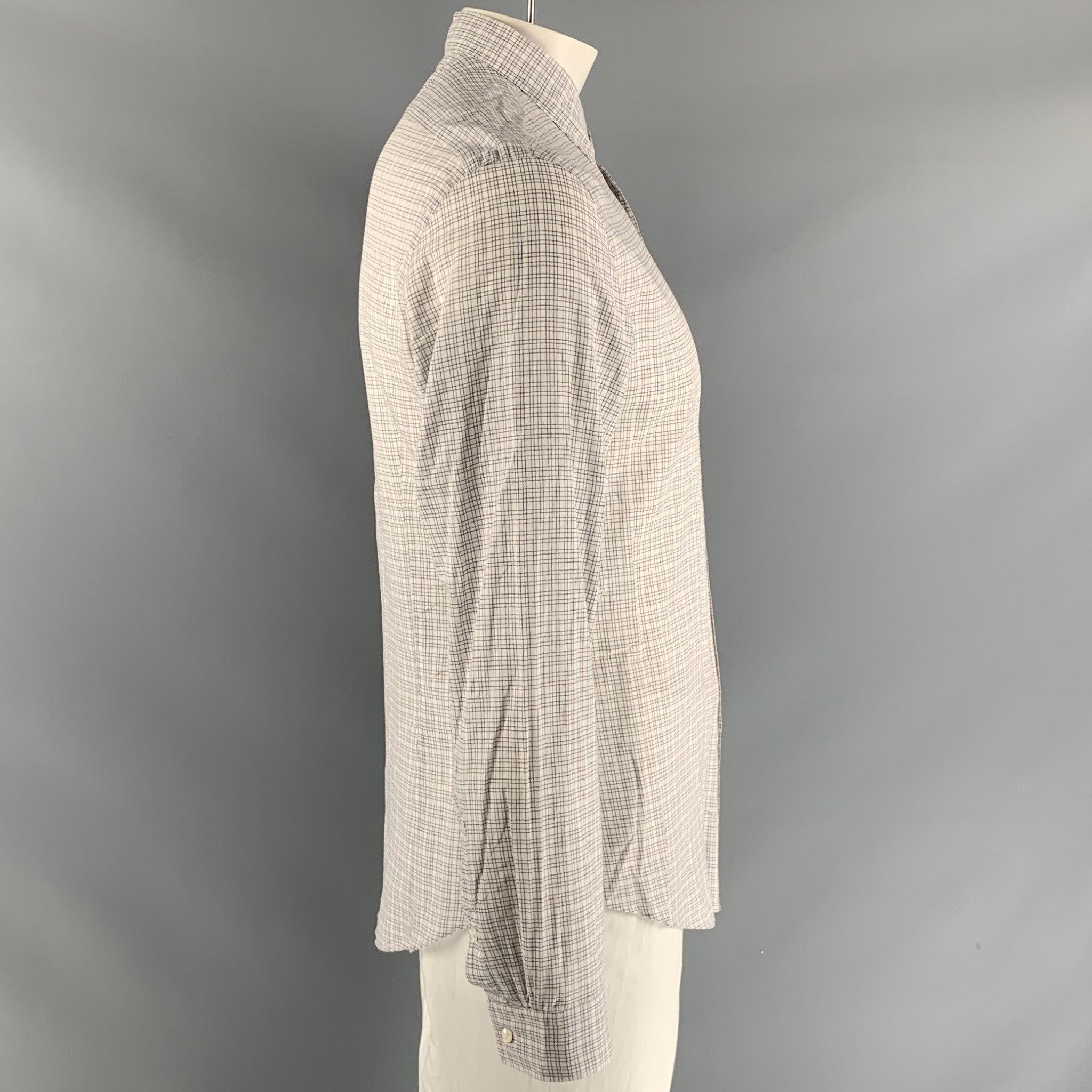 JOHN VARVATOS long sleeve shirt comes in white checkered cotton featuring a patch pocket at left front panel, straight collar, one button square cuff, and button up closure. Excellent Pre-Owned Condition.  

Marked:   M 

Measurements: 
 
Shoulder: