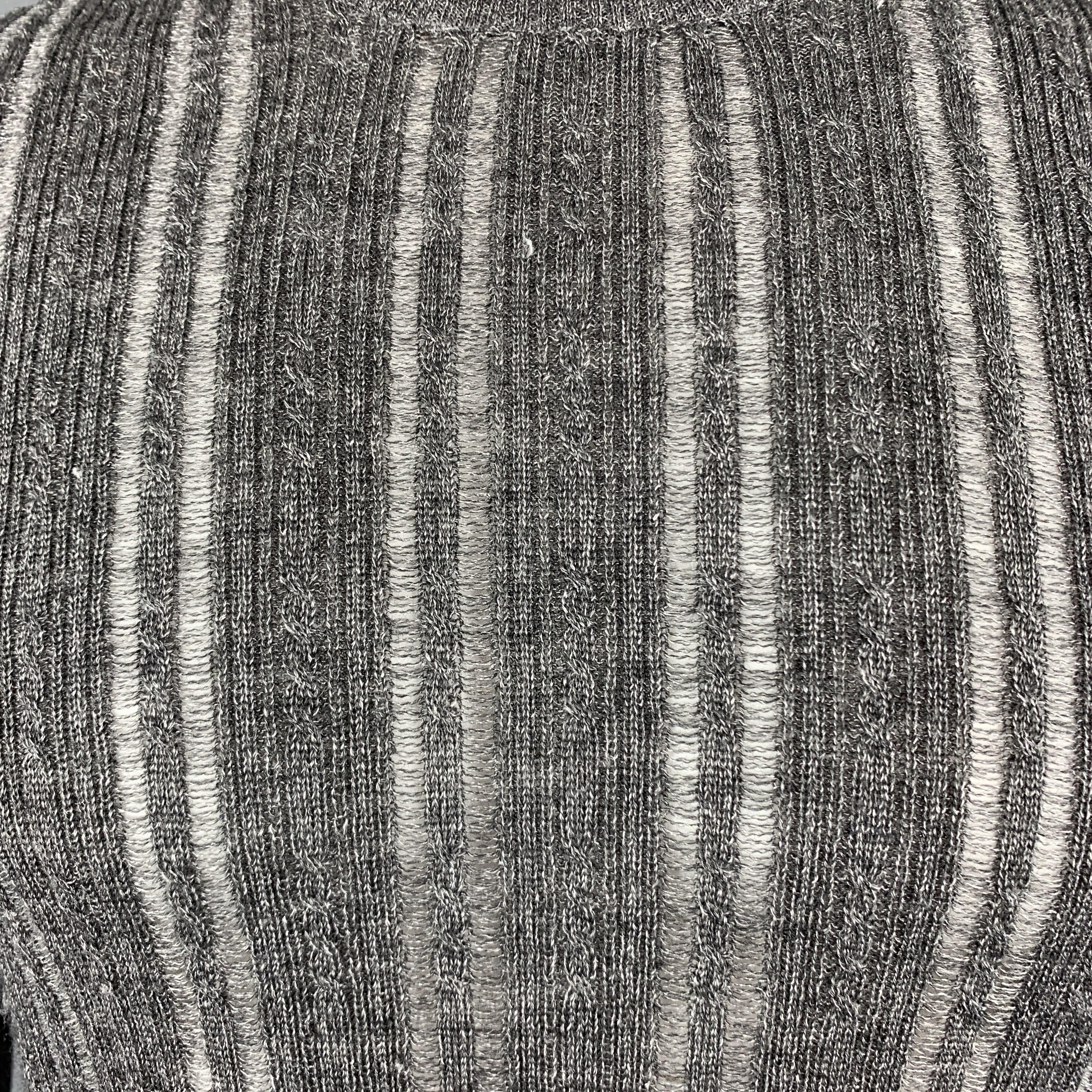 JOHN VARVATOS turtleneck comes in gray heathered metallic knit with a fold ove neck, and burnout stripe body. 

Excellent Pre-Owned Condition.
Marked: S

Measurements:

Shoulder: 16 in.
Chest: 40 in.
Sleeve: 27 in.
Length: 26 in.