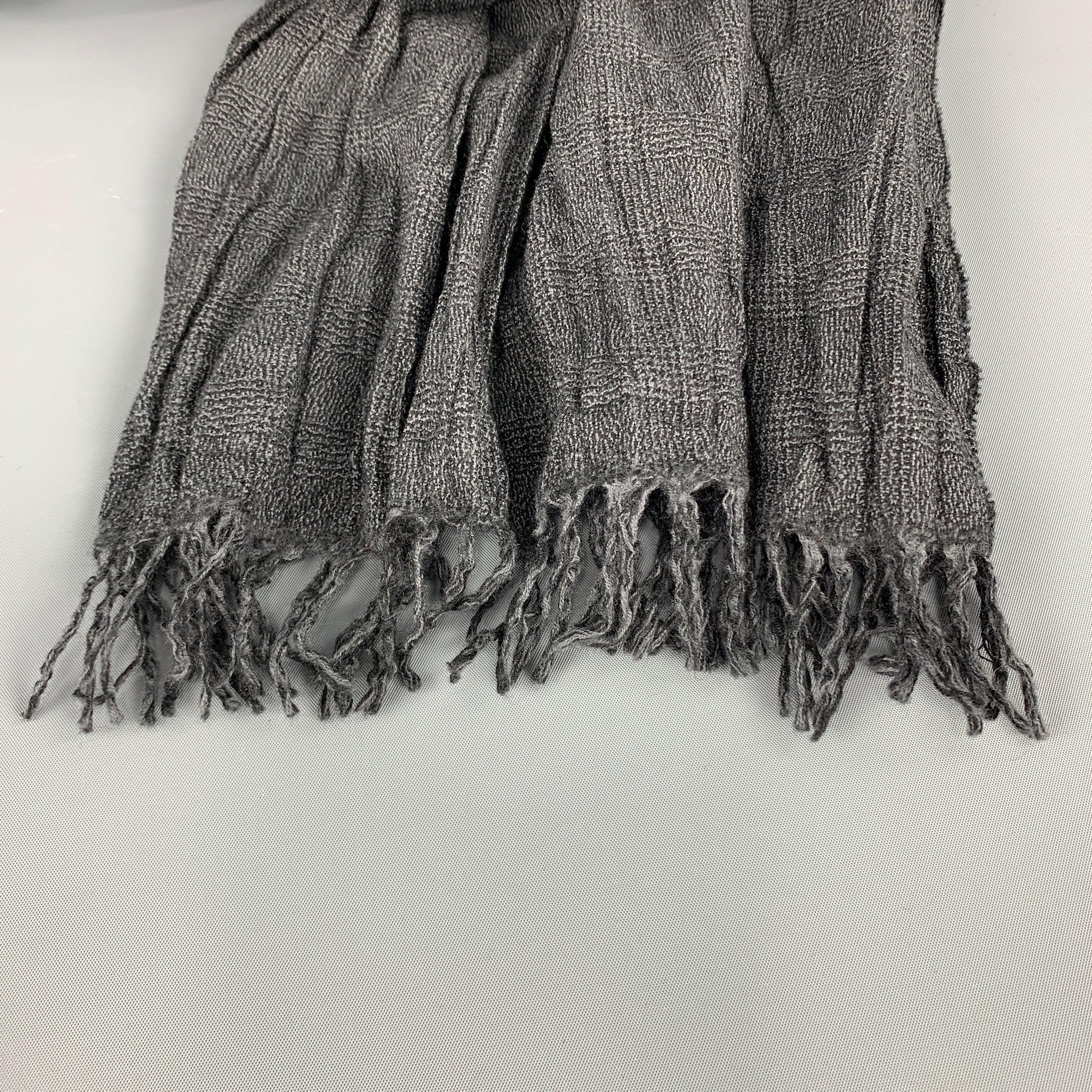 JOHN VARVATOS Scarf comes in charcoal tones in a wool plaid material, with a fringe.
 
Excellent Pre-Owned Condition.
 
88 x 15 in.