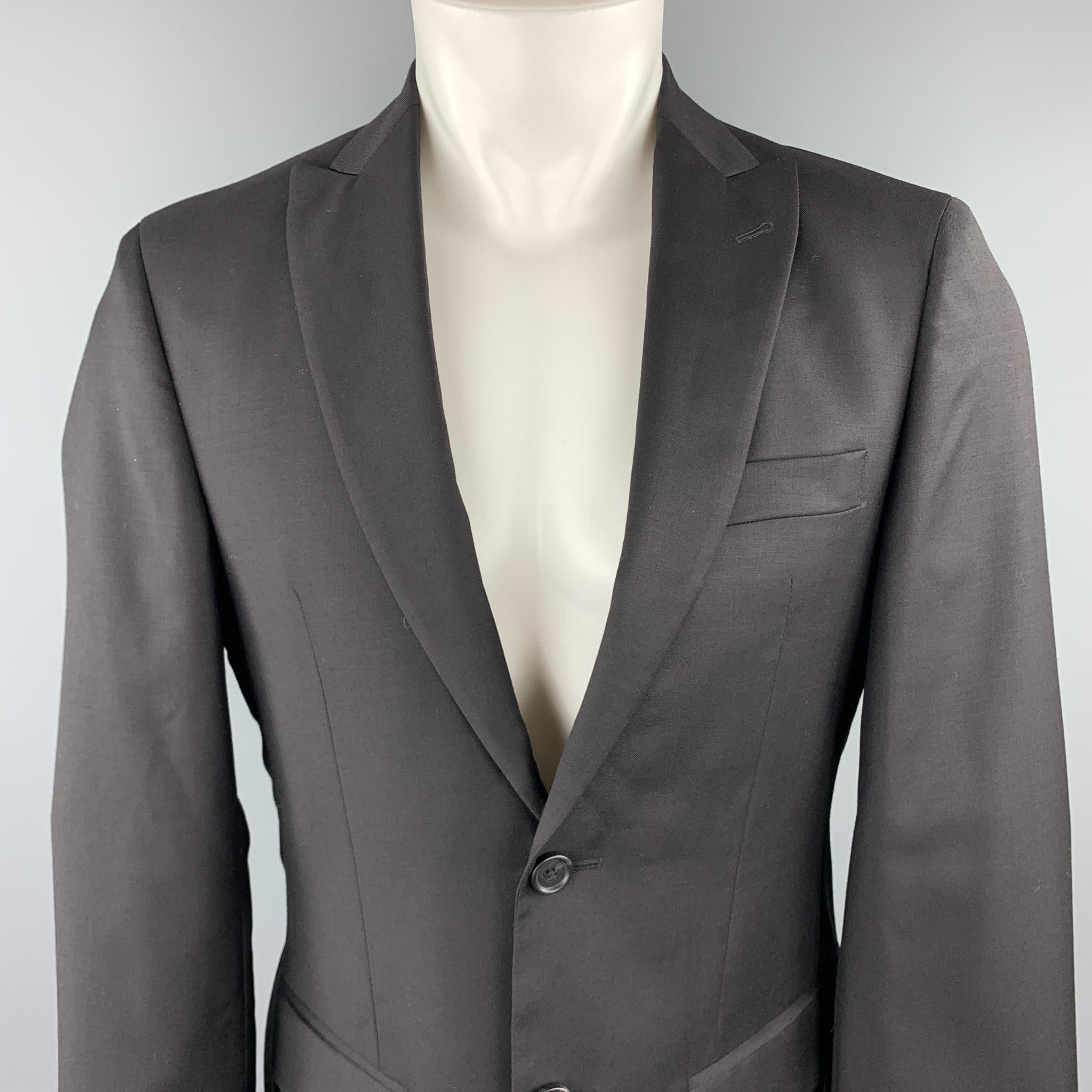 JOHN VARVATOS USA sport coat comes in black wool with a peak lapel, single breasted, two button front, and double vented back. 

Excellent Pre-Owned Condition. 
Marked: US 36

Measurements:

Shoulder: 17 in.
Chest: 40 in.
Sleeve: 24.5 in.
Length: 30