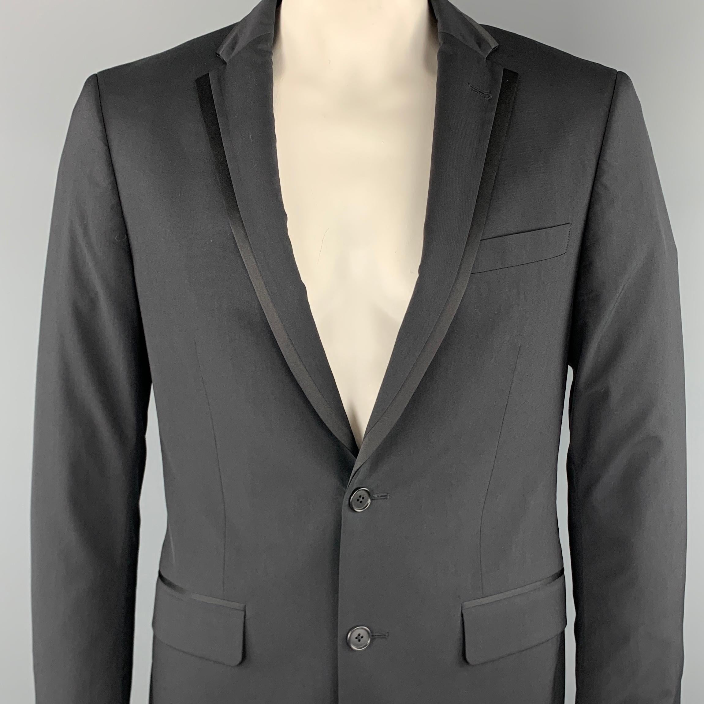 JOHN VARVATOS * U.S.A sport coat comes in a black wool featuring a notch lapel, flap pockets, and a two button closure.

Excellent Pre-Owned Condition.
Marked: 40

Measurements:

Shoulder: 18 in. 
Chest: 40 in. 
Sleeve: 26 in. 
Length: 30 in. 