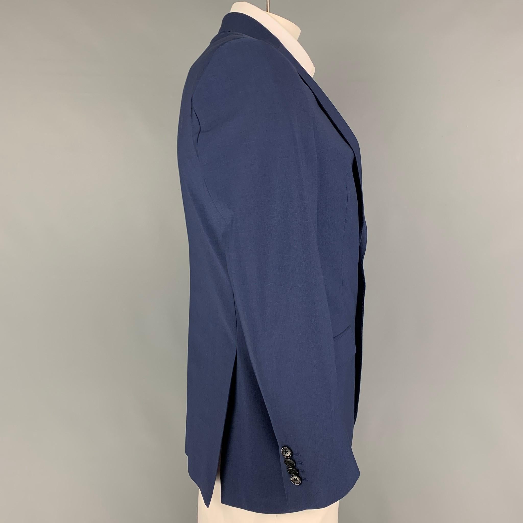 JOHN VARVATOS *U.S.A sport coat comes in a blue wool with a full liner featuring a notch lapel, flap pockets, double back vent, and a double button closure. 

Very Good Pre-Owned Condition.
Marked: 40 R

Measurements:

Shoulder: 18.5 in.
Chest: 40
