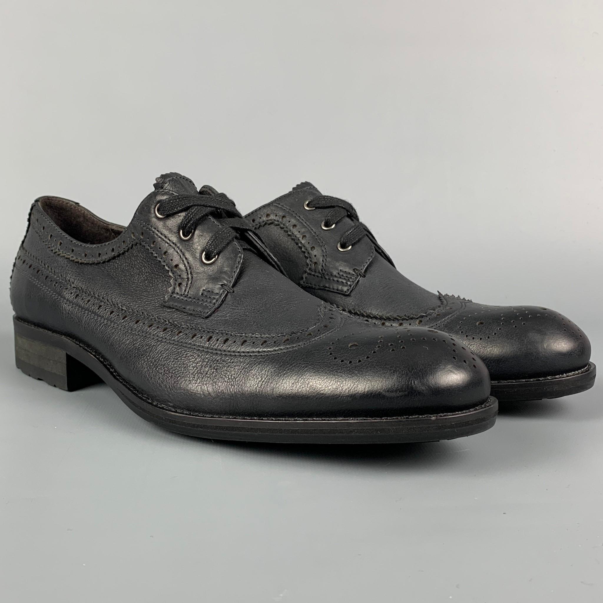 JOHN VARVATOS *U.S.A. shoes comes in a black perforated leather featuring a wingtip style, rubber sole, and a lace up closure. 

Very Good Pre-Owned Condition.
Marked: 8M

Outsole: 11.25 in. x 3.5 in. 