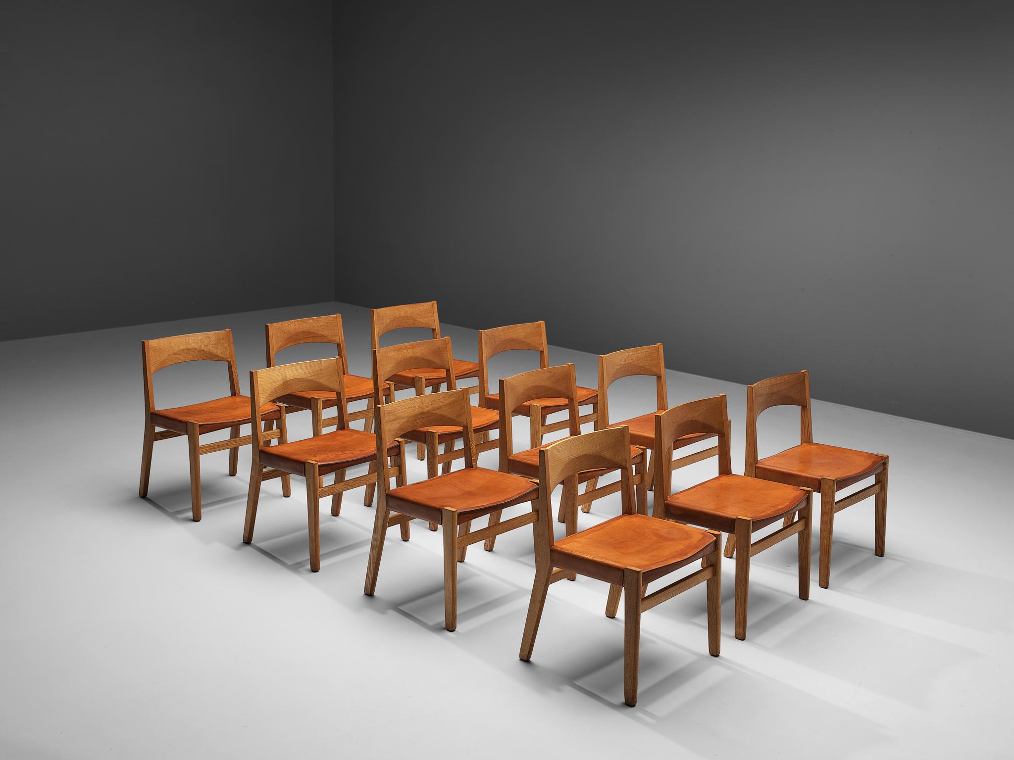 John Vedel-Rieper for Erhard Rasmussen, set of 12 dining chairs, oak, leather, Denmark, 1957.

Danish designer John Vedel-Rieper created this dining chair in 1957 for Erhard Rasmussen. The strong lines and the well-designed proportions as well as