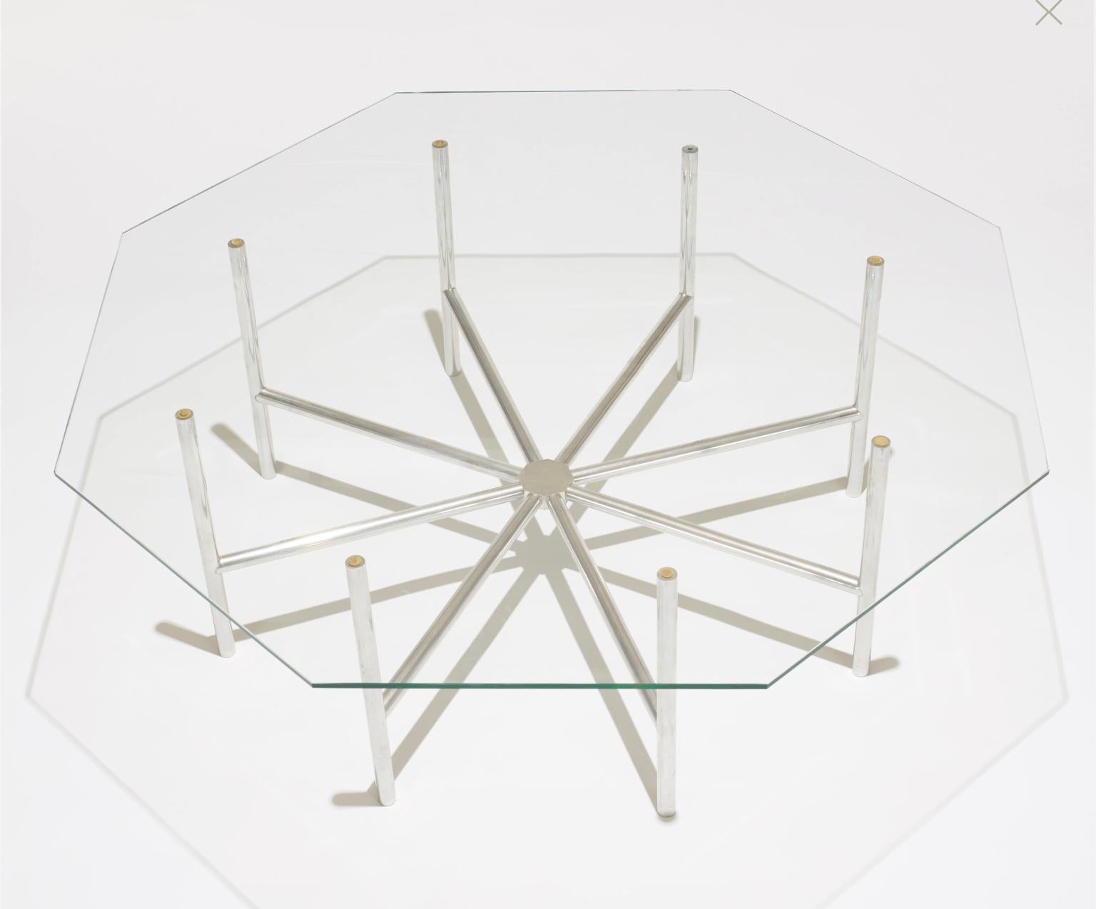 Rare cocktail table from John Vesey's famous 1958 collection. Polished aluminum spokes connecting to a central nut, with original octagonal glass top. Model V-59 in the John Vesey catalog.