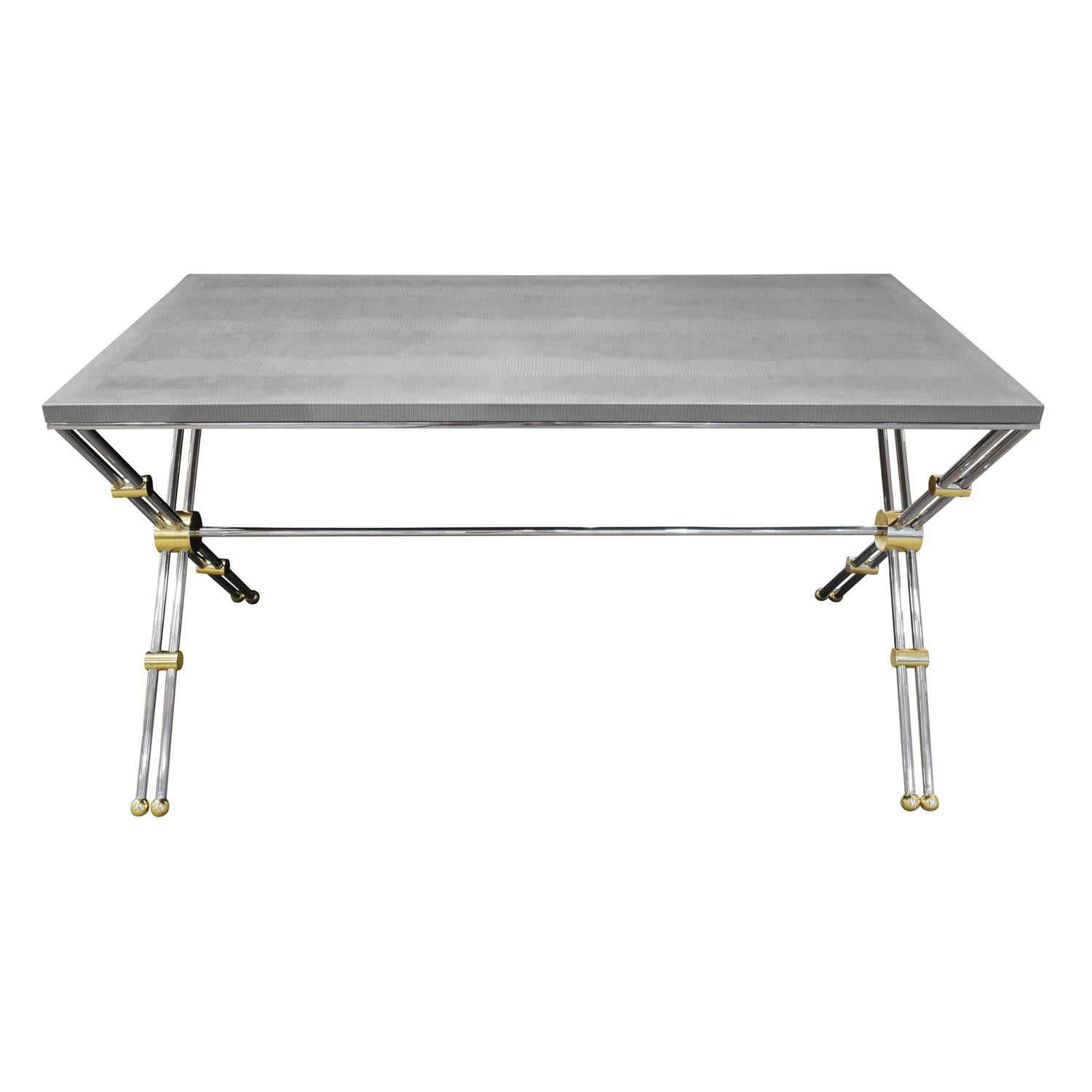 Rare writing desk in polished stainless steel and brass with custom embossed lizard leather top by John Vesey, American, 1970's. Light gray embossed lizard top fabricated by Lobel Modern.