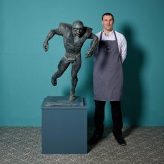 John W. Mills (1933-2023) ‘American Footballer’ Patinated Sculpture