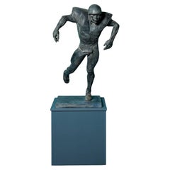 John W. Mills (1933-2023) ‘American Footballer’ Patinated Sculpture