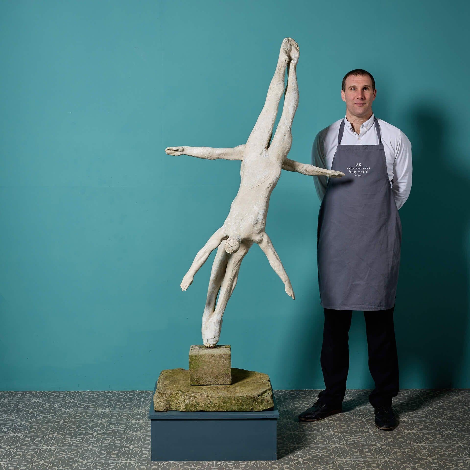 A large maquette sculpture titled 'Preparation and Entry' by the acclaimed British sculptor, John W. Mills, stood upon an integral square stepped stone base.

Part of the divers in motion series, this patinated resin sculpture captures the grace and