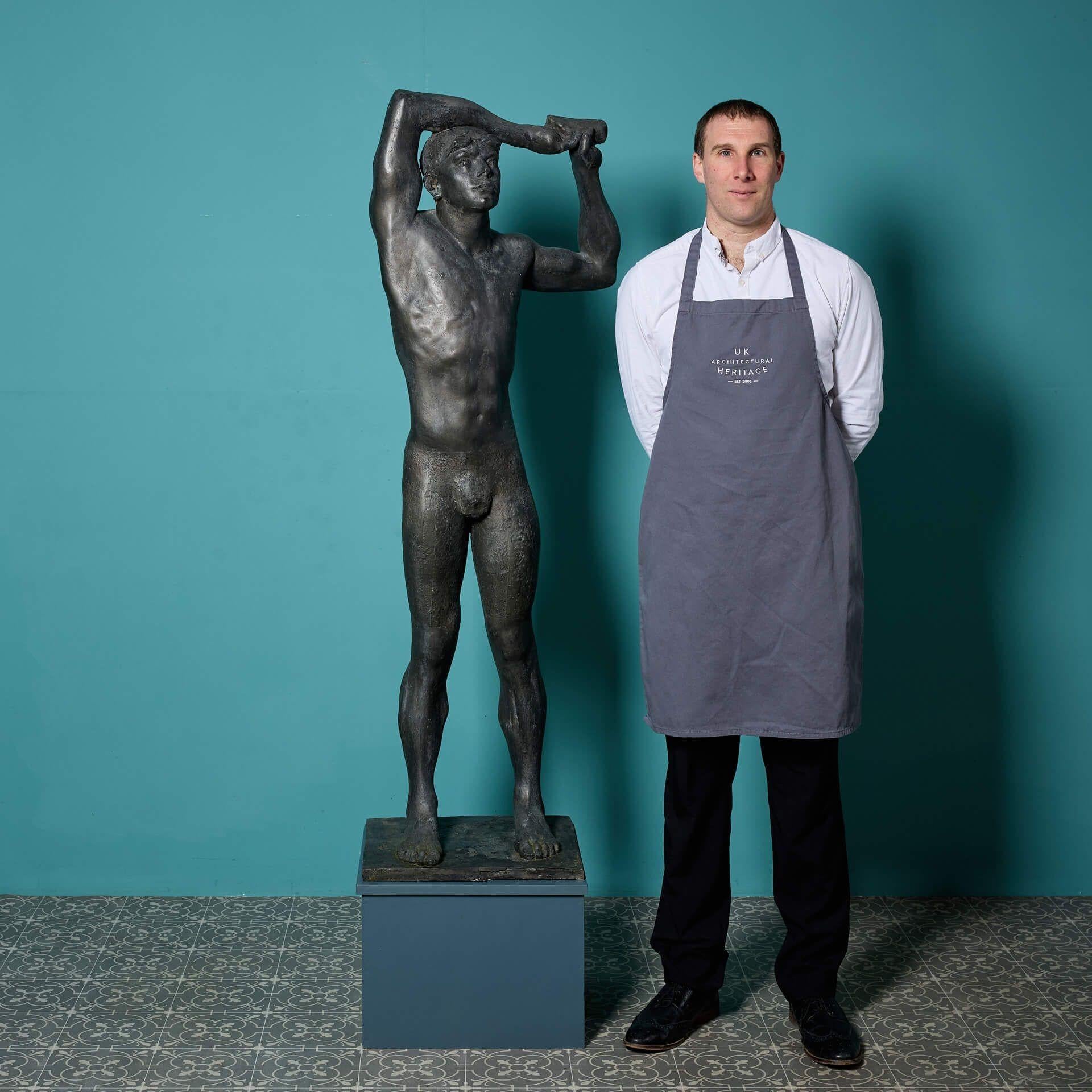 A patinated resin sculpture titled ‘Warming Up' by the acclaimed British sculptor, John W. Mills, stood on an integral square base.

Part of the divers in motion series, this patinated resin 3/4 life size sculpture captures the grace and athleticism