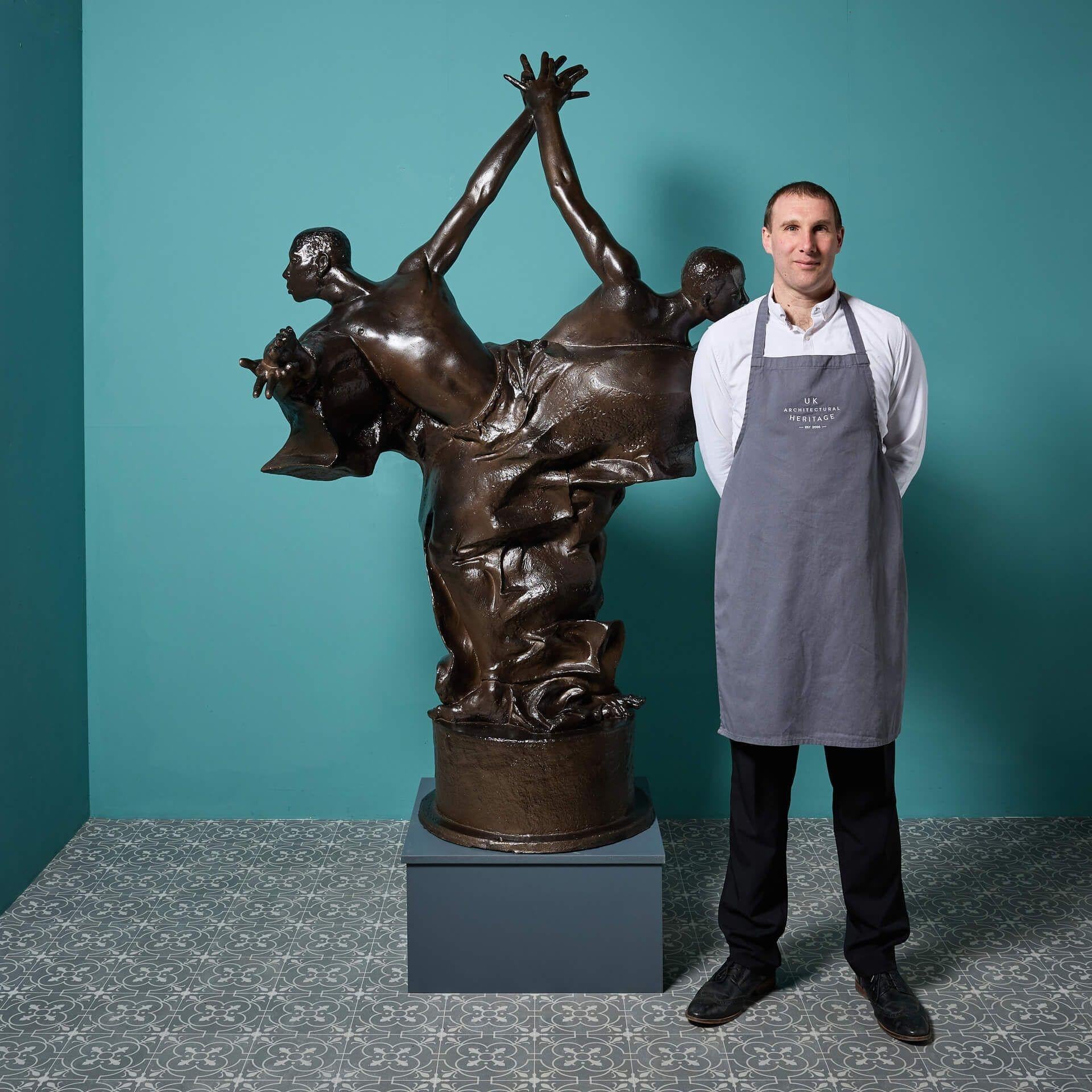 A lifesize bronzed statue titled 'The Three Kings’ by the acclaimed British sculptor, John W. Mills. Mounted  upon an integral circular base, this impressive statue is a maquette made for the original bronze, crafted in fibreglass resin and finished