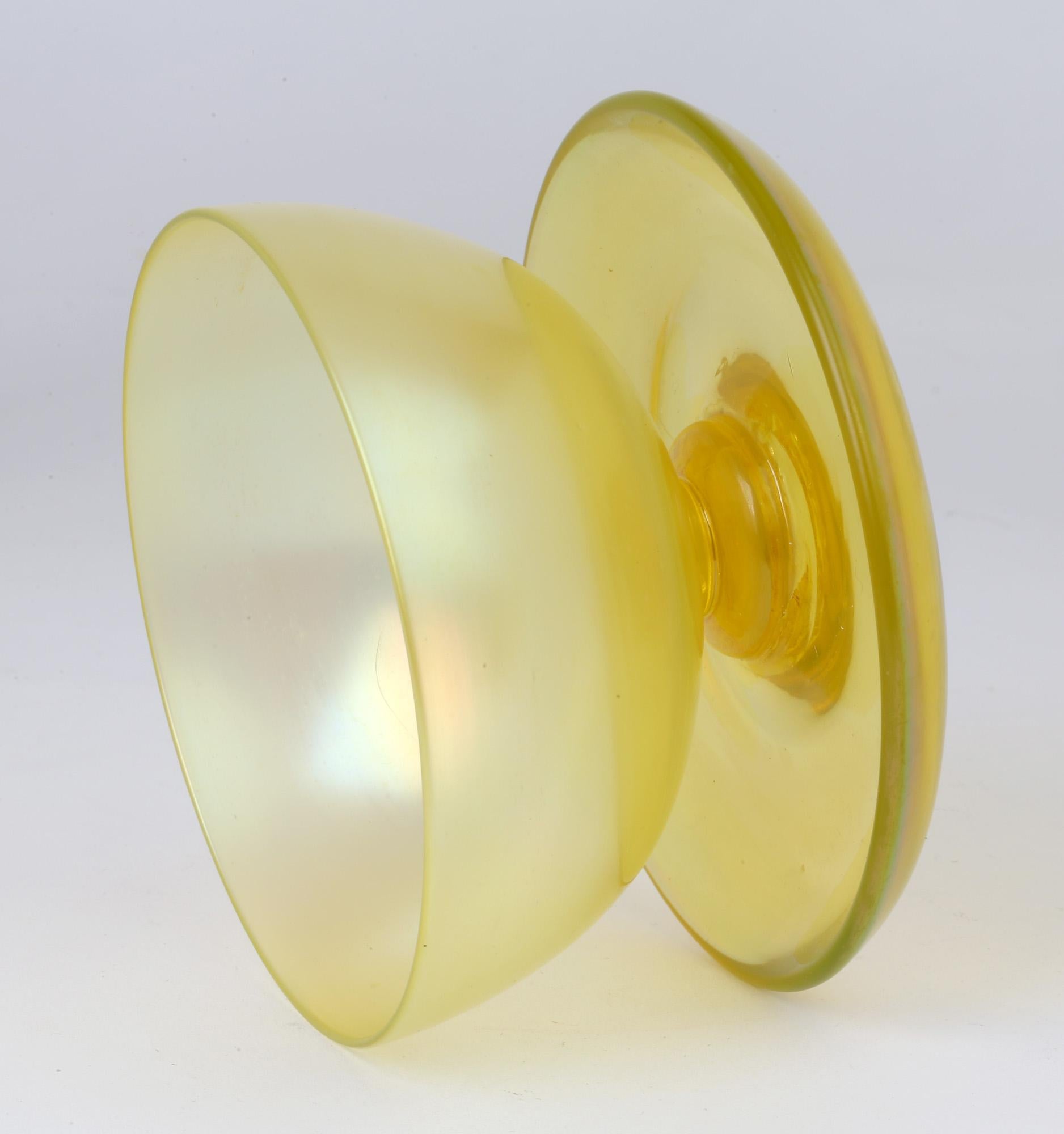 A fine Art Deco John Walsh Walsh iridescent Sunbeam uranium yellow art glass pedestal bowl dating from circa 1929. The open rounded pedestal bowl has a wonderful yellow iridescent finish and is mounted on a thick rounded dish shaped base. The bowl
