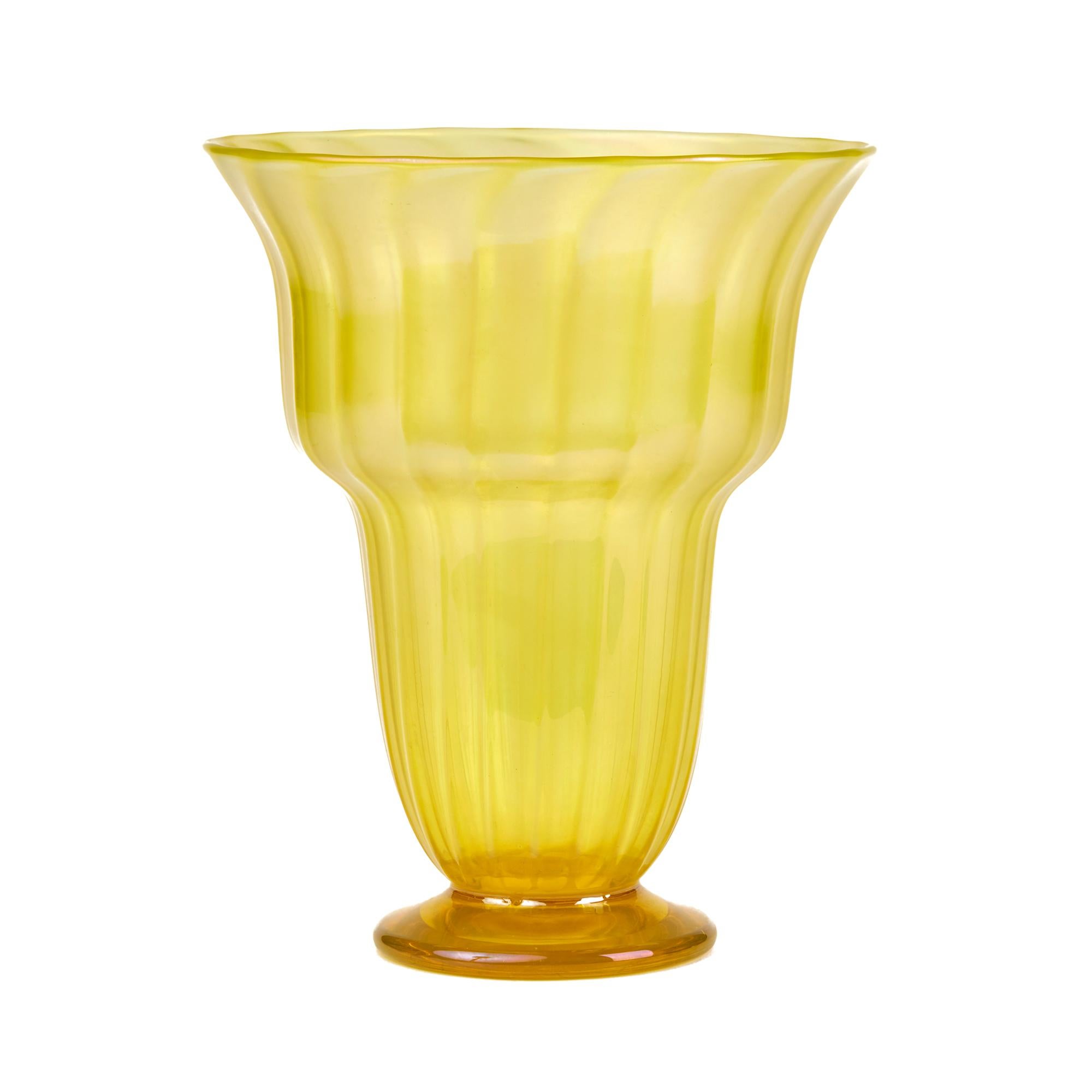 A rare and large Art Deco John Walsh Walsh iridescent Sunbeam uranium yellow art glass vase standing on a narrow rounded glass foot with an opening bud shaped body with vertical ribbing. The vase has a wonderful yellow iridescent finish and has a