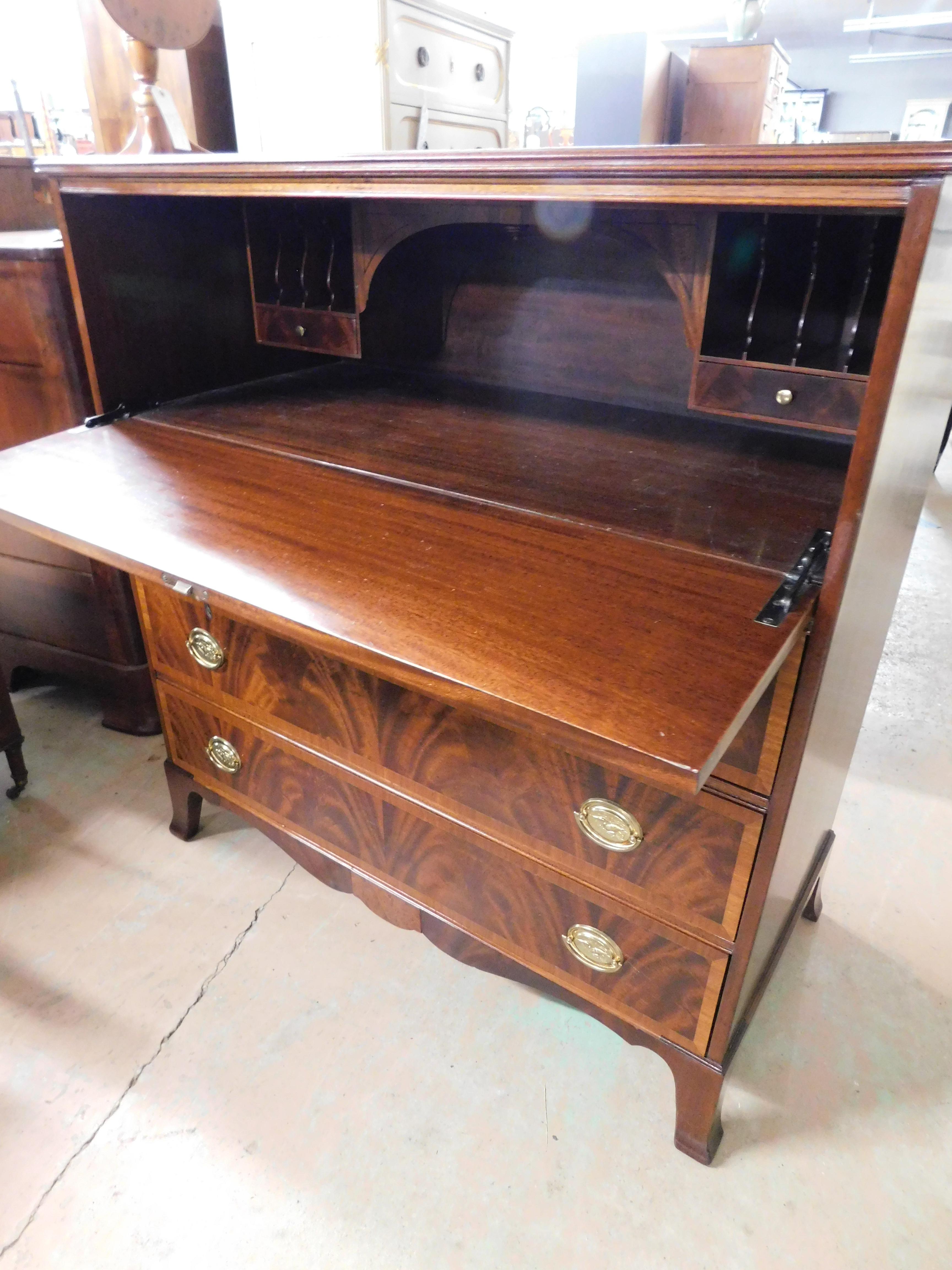 Features fine high quality made construction, 3 Large Dovetailed Drawers, Drop front writing surface with 2 internal small drawers, Figured Mahogany Satinwood Inlay, Brass Hardware, with Key

approx 80 years old

Very Good Antique Original