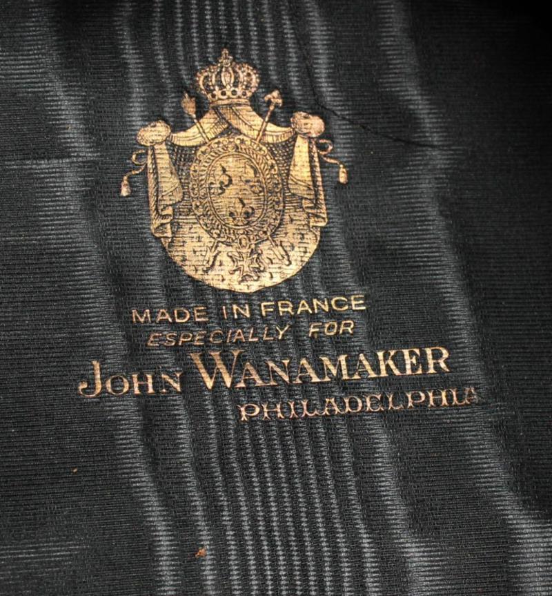A John Wanamaker top hat with fitted leather travel case.
Marked 