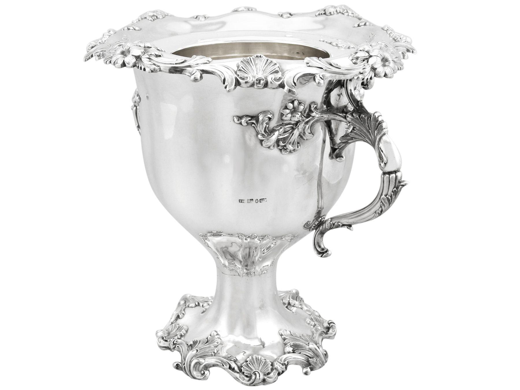 An exceptional, fine and impressive antique Victorian English sterling silver wine or champagne cooler; an addition to our presentation silverware collection

This exceptional antique sterling silver wine cooler has a circular plain rounded bell