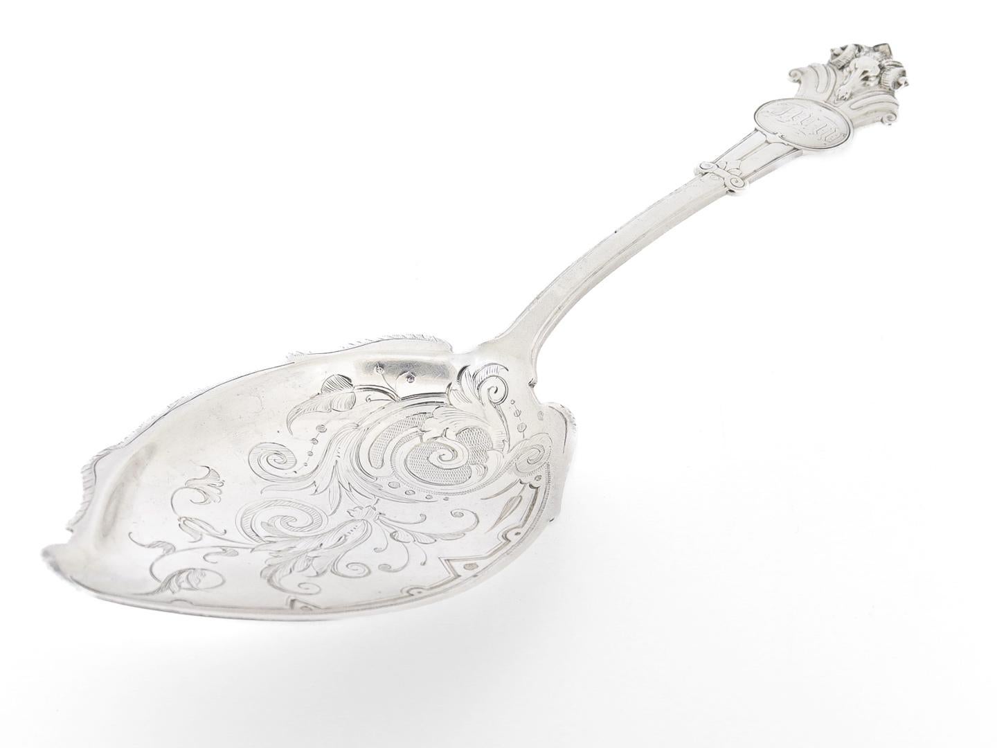 A fine antique silver ice cream slice or server.

Made by by John Wendt and retailed by J.E. Caldwell of Philadelphia, Pennsylvania.

With brite cut floral decoration to the bowl and a ram's head to the handle.

Monogrammed just beneath the ram's