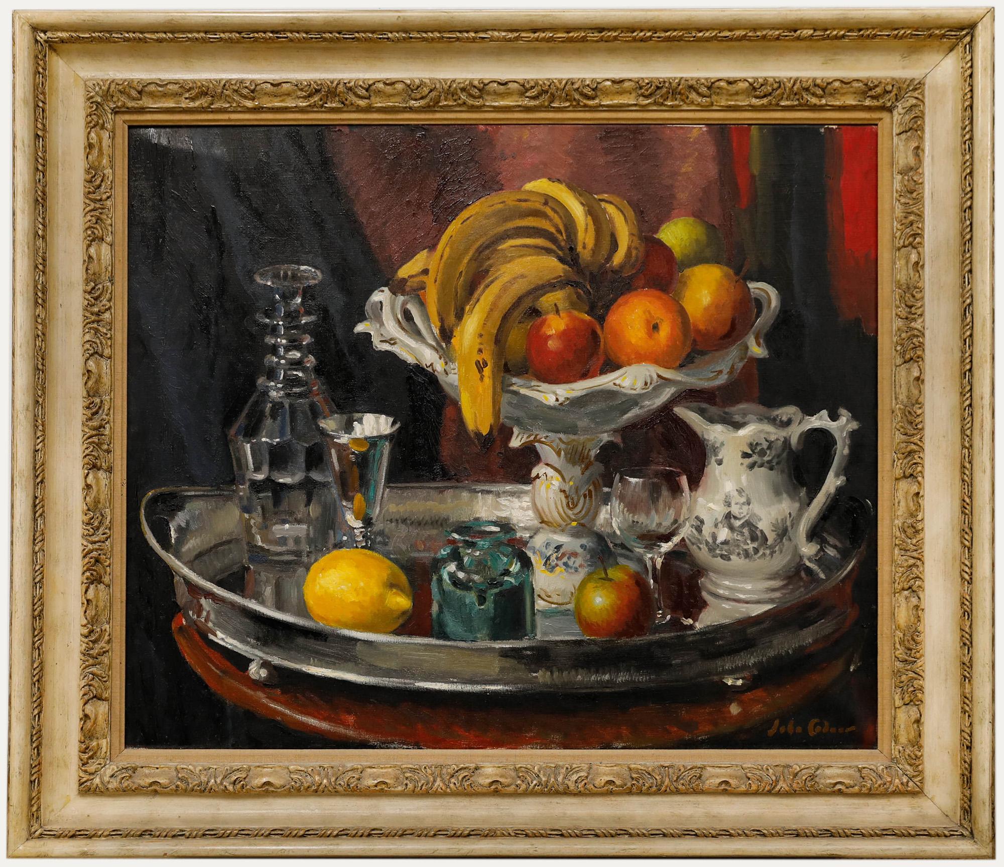 This vibrant still life painting by John Whitlock Codner RWA (1913-2008) captures a sumptuous array of fruits, glassware, and porcelain arranged on a silver tray. Signed to the lower right. Well presented in a large wooden frame with several carved