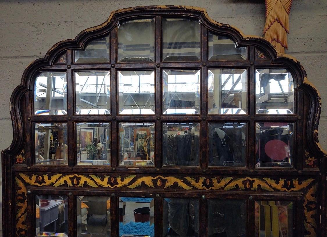 With its sixty four integrated beveled mirrors, this John Widdicomb Baroque pier mirror is sure to impress. The piece is all original, circa 1960s, and comes with paint loss to the frame. That said, structurally it is fine. This had to be a very