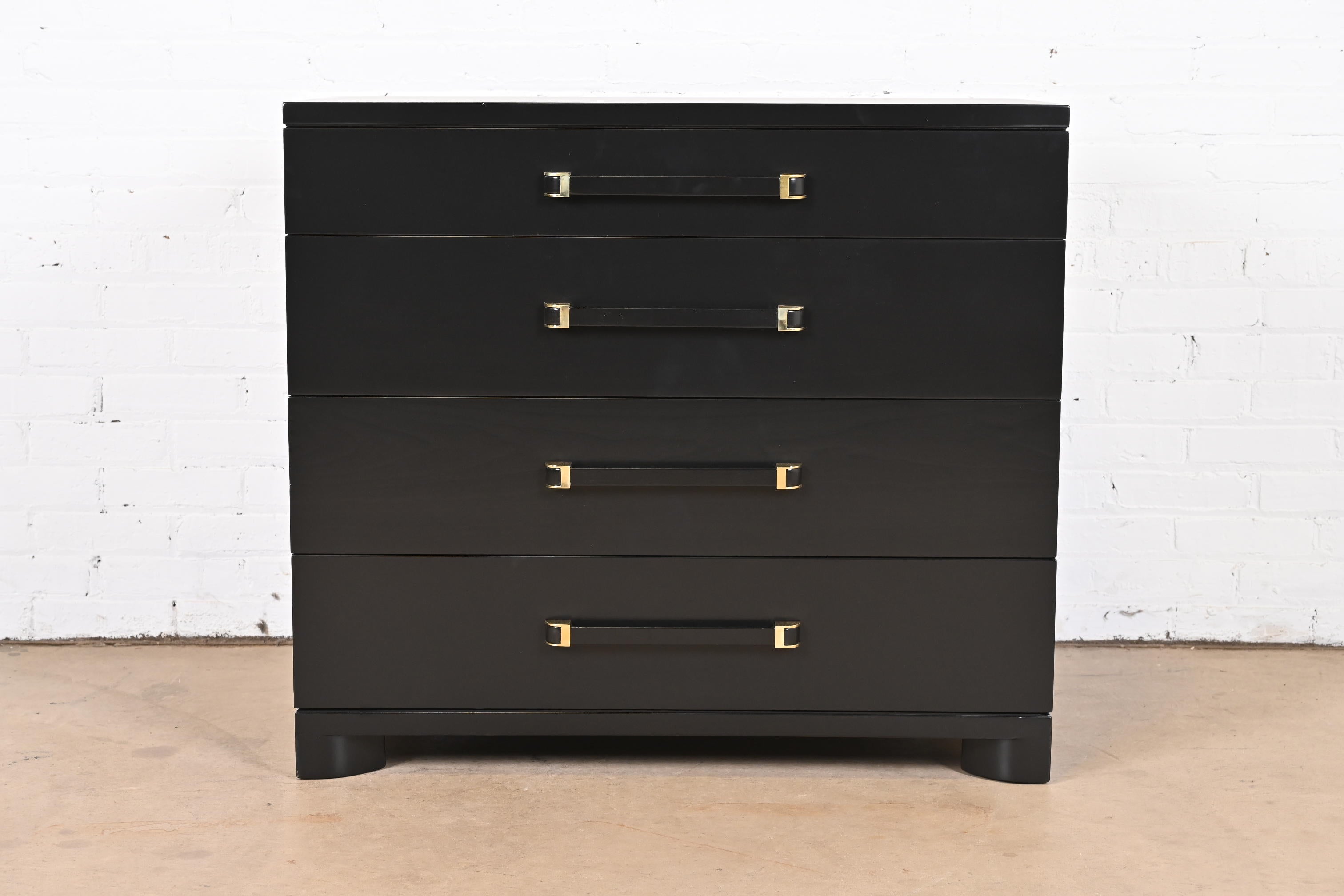 A gorgeous Art Deco or Mid-Century Modern dresser or chest of drawers

By John Widdicomb

USA, Circa 1940s

Black lacquered mahogany, with brass accents.

Measures: 36